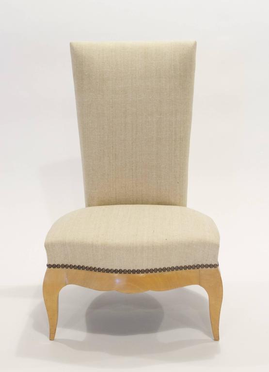 This French Art Deco sycamore slipper chair (chauffeuse) was designed by Rene Prou and made by Maison Gouffe. Prou (1889-1947) was a notable French decorator and furniture designer, who became the chief designer for Maison Gouffe in Paris. Called