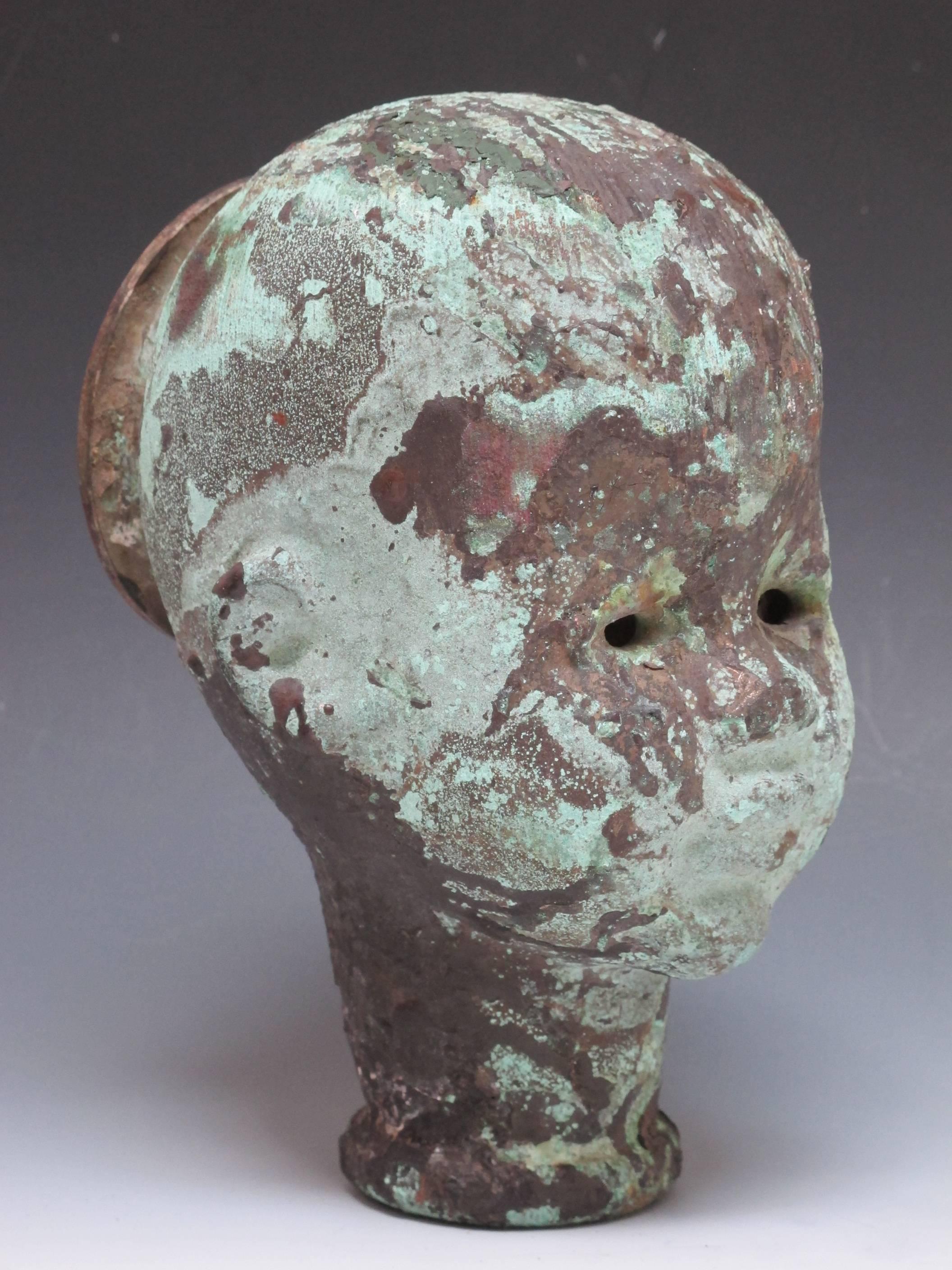 Unusually large doll head mold with circular opening on back of the head.
Rubber resin would be poured into the opening and the flexible rubber would be pulled out from the same opening. Doll making has moved to China long ago and the doll