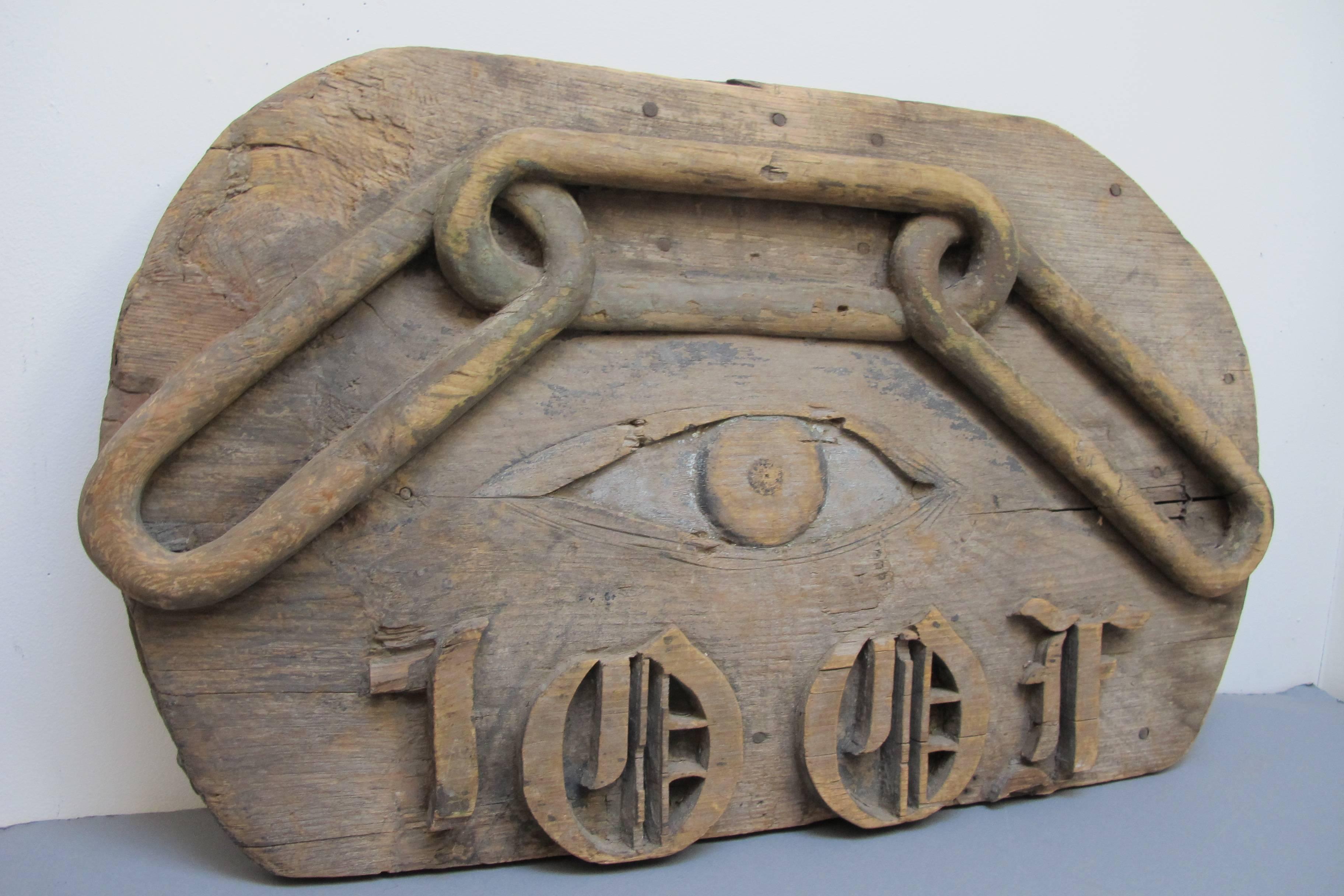 Carved wood sign from a Pennsylvania fraternal lodge with 'All Seeing Eye'.
The three links of a chain stands for members bond of Friendship, Loyalty, and Trust. Below are the initials IOOF of International Order of Odd Fellows.
