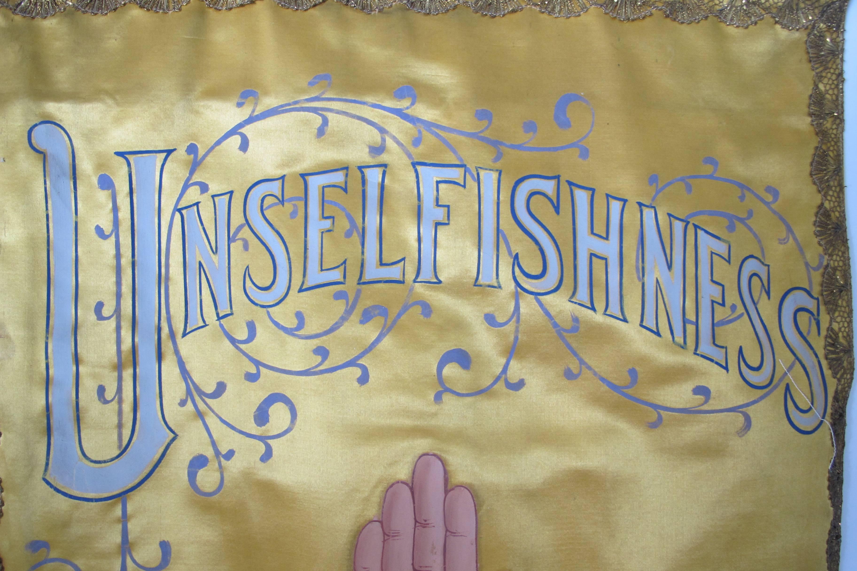 Fraternal lodge banner with heart in hand-painted on silk with fancy script above saying Unselfish. Among the qualities of brotherhood and charity valued by the International Order of Odd Fellows IOOF was unselfishness. This is a rare banner in