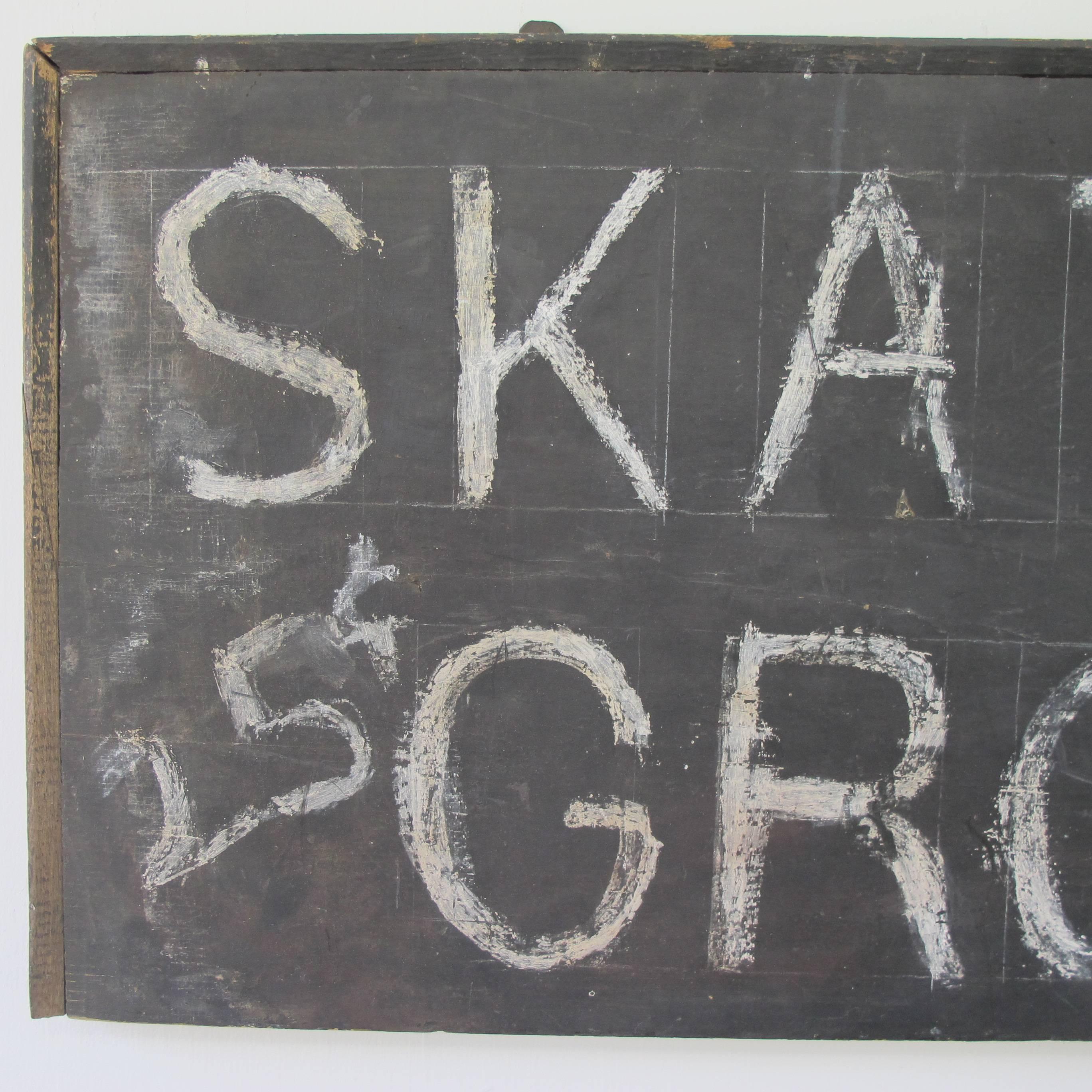 Graphic old hand-painted sign skates ground 25 cents. The sign retains two old metal tabs along top edge that were used to hang it.
                    