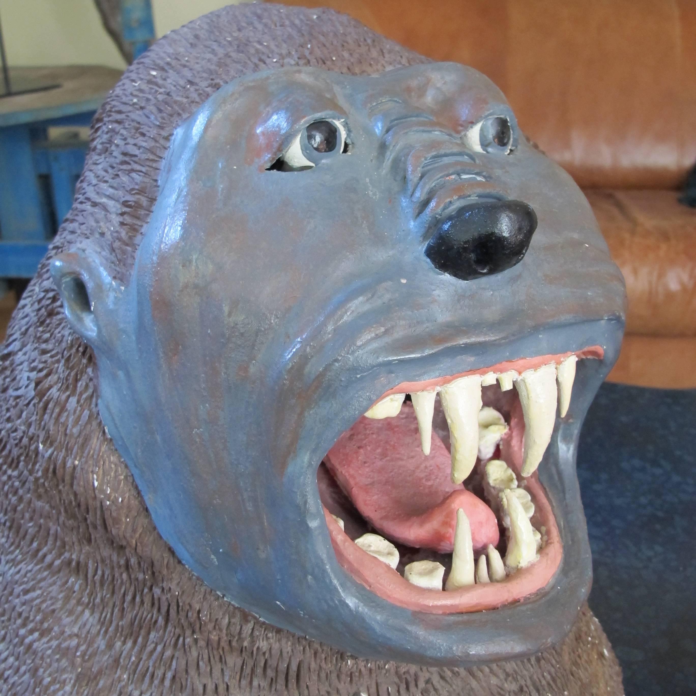 This gorilla head was said to have been set on top of a carnival shooting gallery. 
In the carnival spirit it was intended to illicit awe and wonder and maybe a little fear with the open mouth filled with sharp teeth. I was amazed to find that it