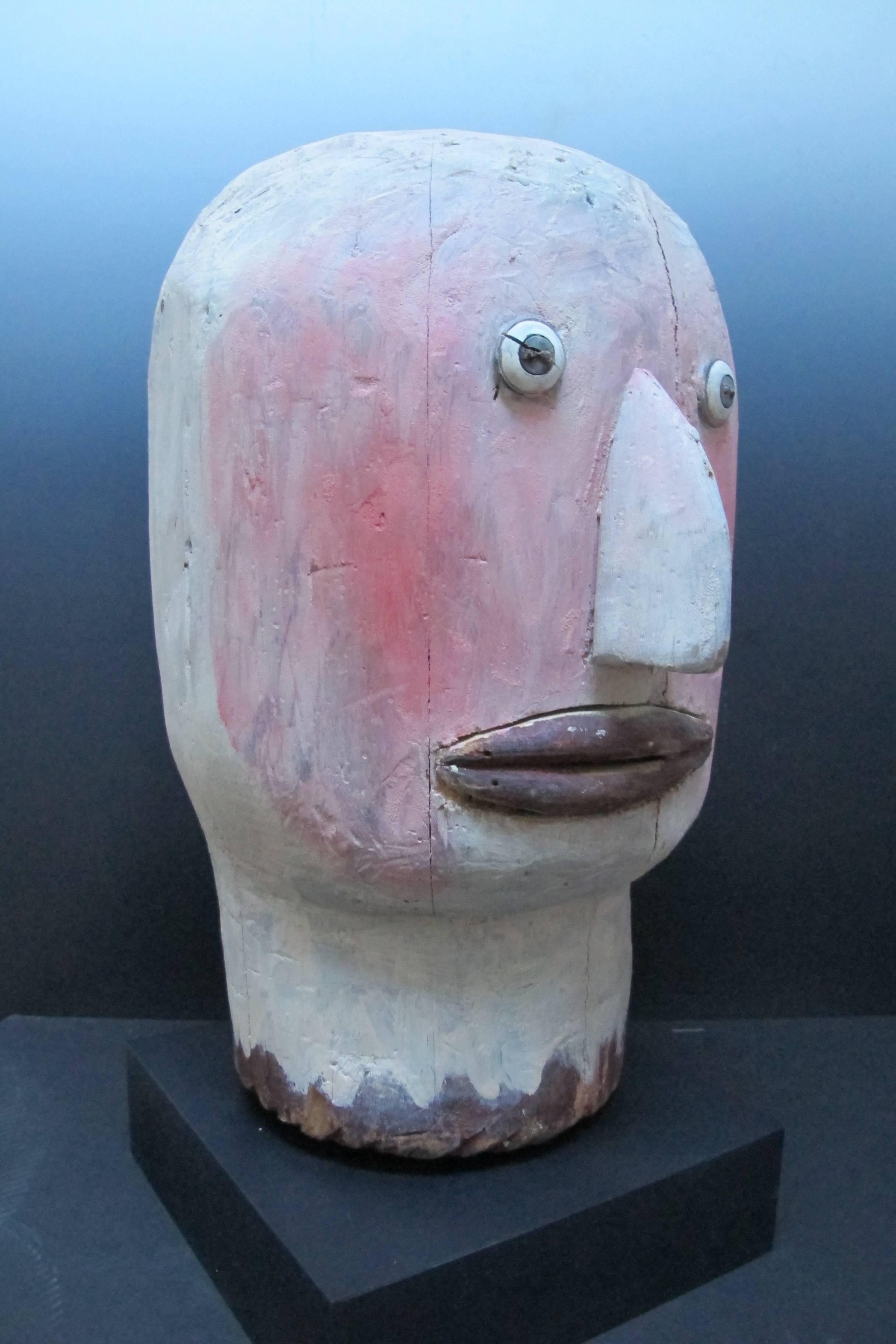 A larger than life wood head that came out of a Masonic Temple in Cape Breton.
I have not seen such a primal head from a lodge before. It has an applied nose, mouth and button eyes. It is unusually painted with white and flesh tones. It has the