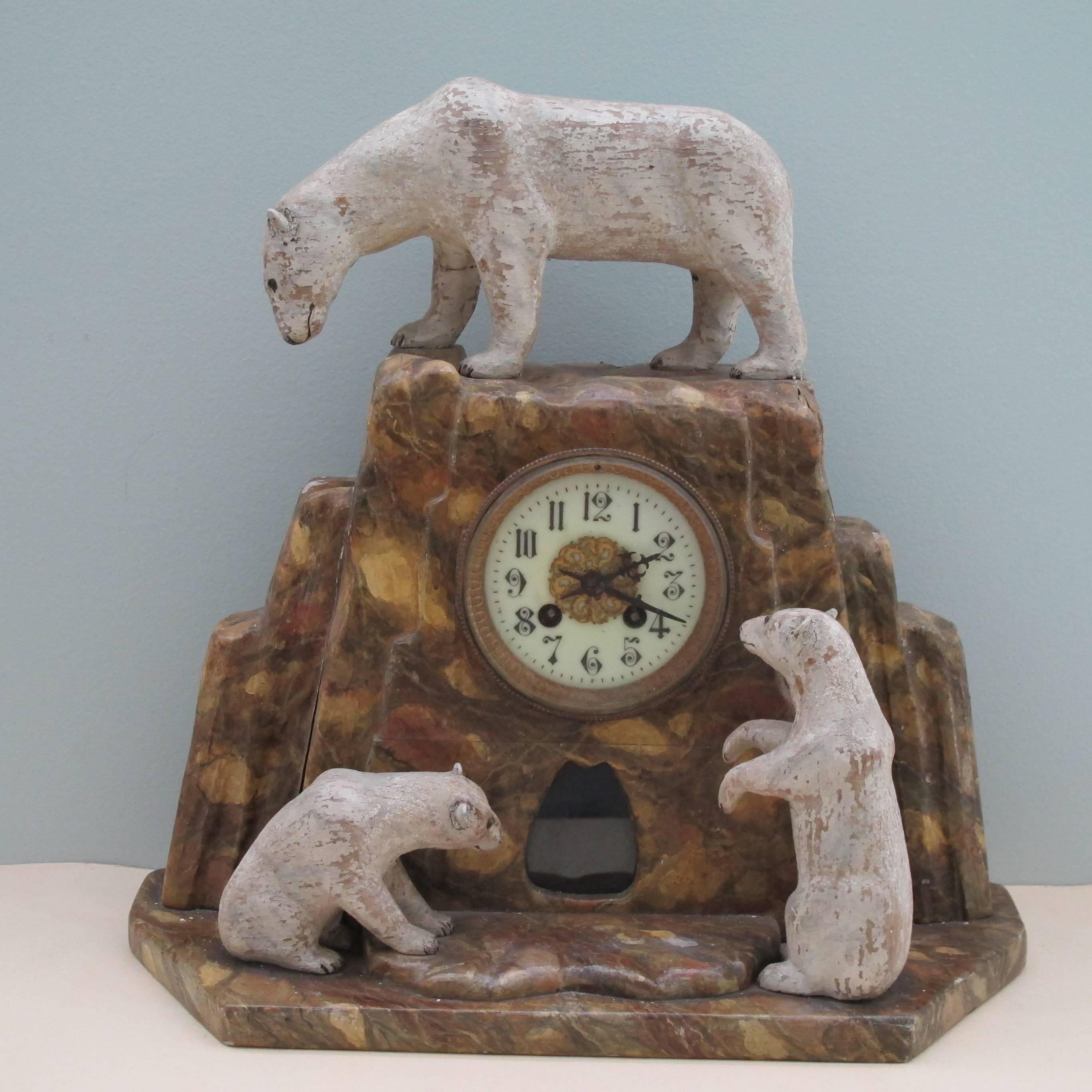 Fanciful creation by unknown NH maker of a mantel clock with carved polar bears. A pair of painted wood vases came with it each flanked by a pair of birds which appear to be penguins. I am not knowledgeable about clocks. It is probably manufactured