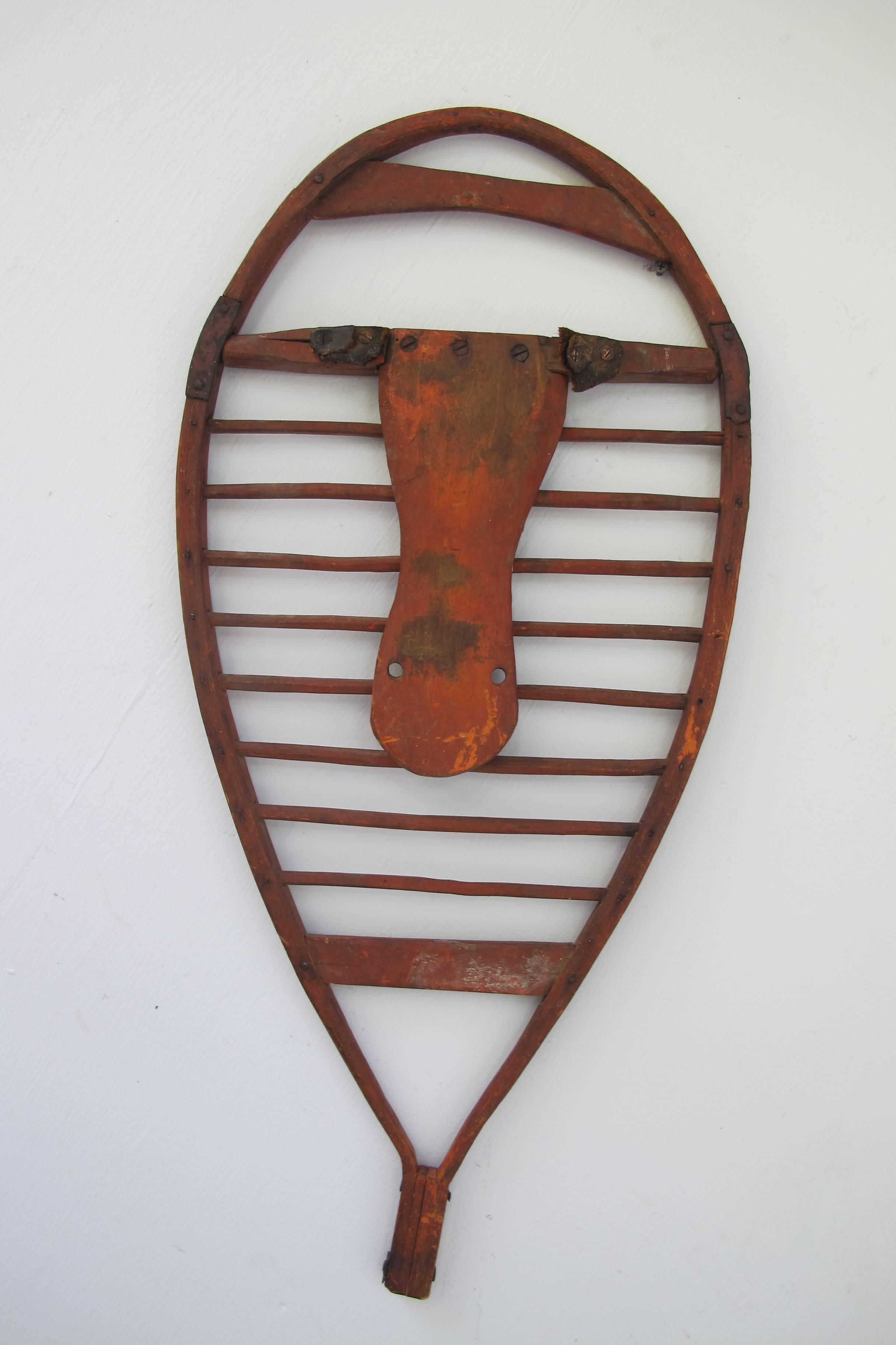 Rare pair of bentwood snowshoes with wood dowels crosspieces pegged to frame.
There are shaped wood pieces to strap on the boots with remains of old leather straps.
Wonderful old reddish brown wash on the surface. These were skillfully made and