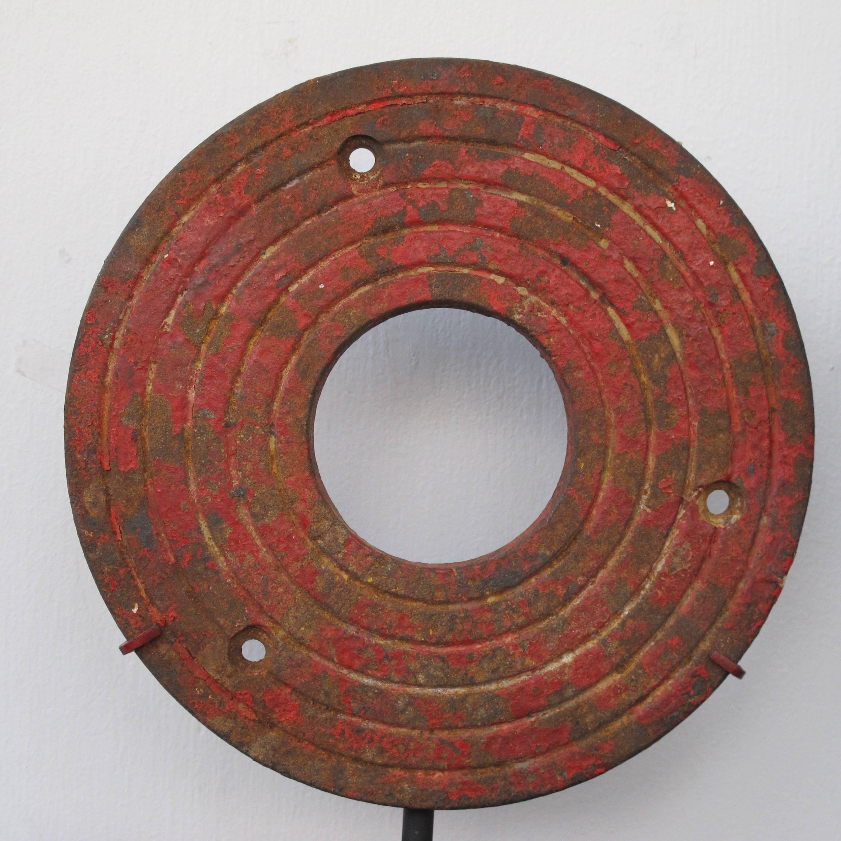 Graphic cast iron shooting gallery targets from a carnival.
These have had decades of use and paint and are now mounted over black metal bases as works of art.