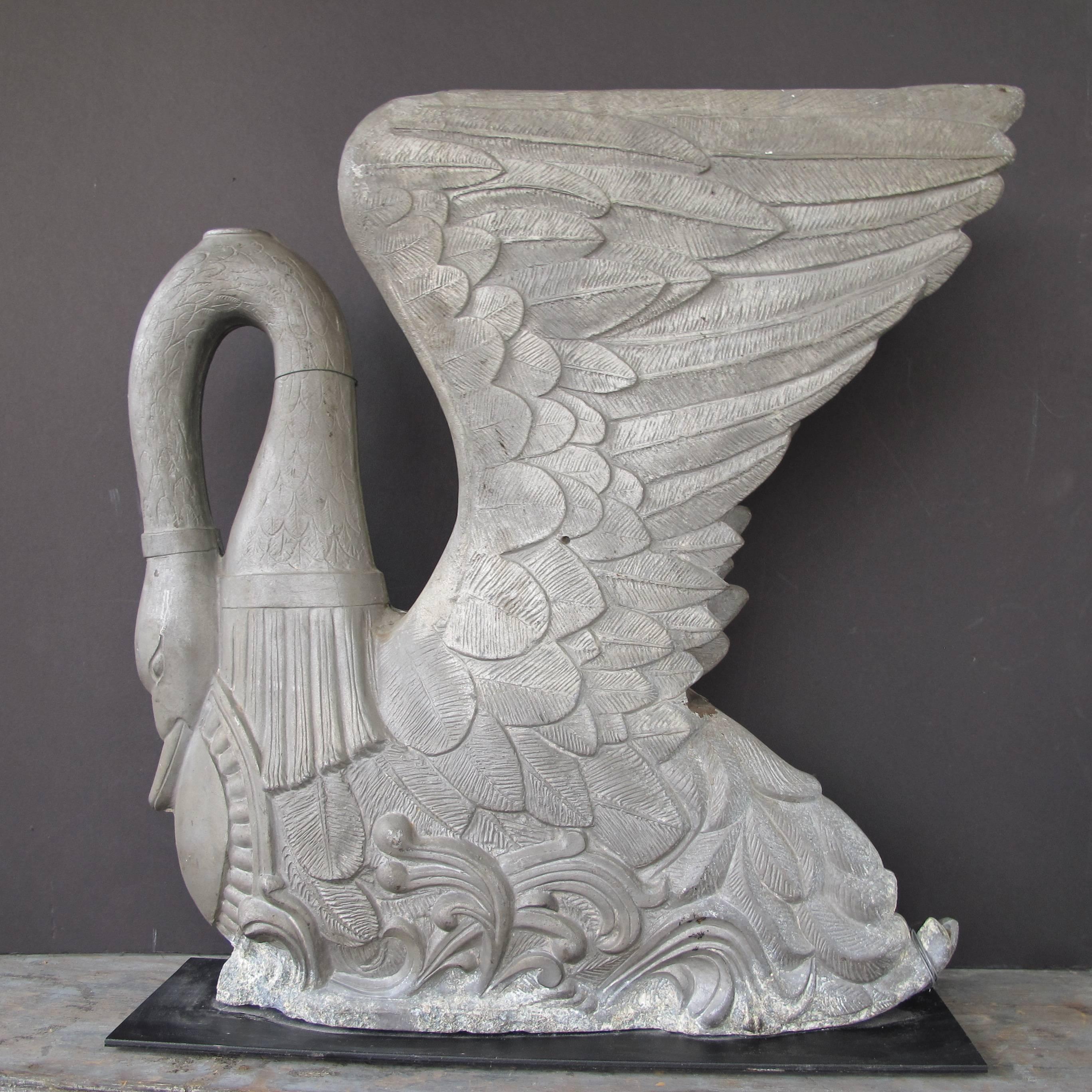 Sculptural large swan mold with intricate detailing. The swan mold is made in two pieces and wired together and has been mounted on a metal base.
I do not know what the cast zinc pieces was made for bur a past owner Eli Buck thought it was a