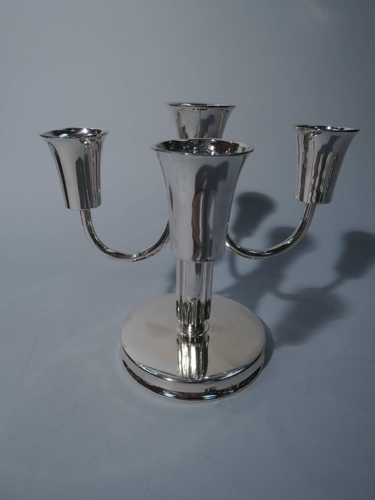 Austrian Art Deco silver 5-light candelabrum. Fluted pillar shaft supporting central socket and 4 c-scroll arms each terminating in single socket. Shaft mounted to circular base with concave sides. A striking solo stick. Hallmarked. Very nice