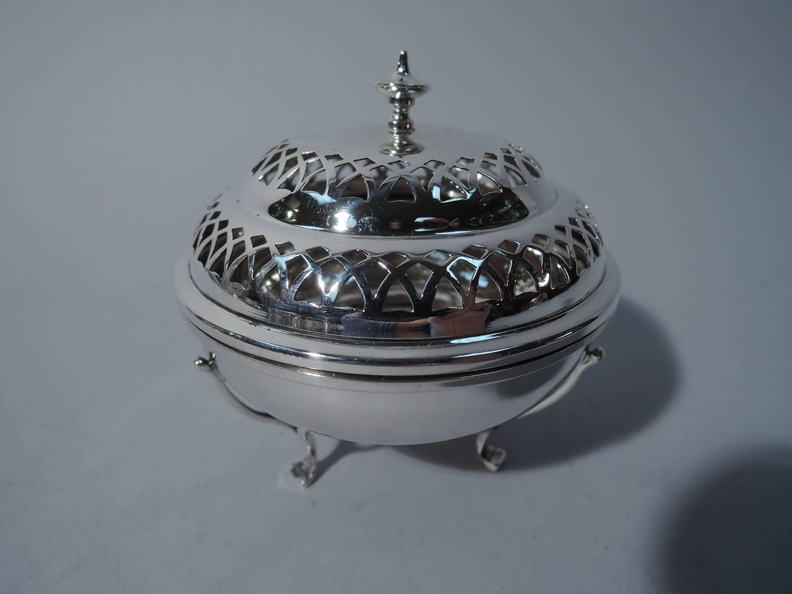 George V sterling silver censer. Made by Synyer & Beddoes in Birmingham in 1911. Curved and shallow bowl on three supports with elongated trefoil mounts. Double-dome cover has pierced arcades and ornamental finial. An elegant and old fashioned air