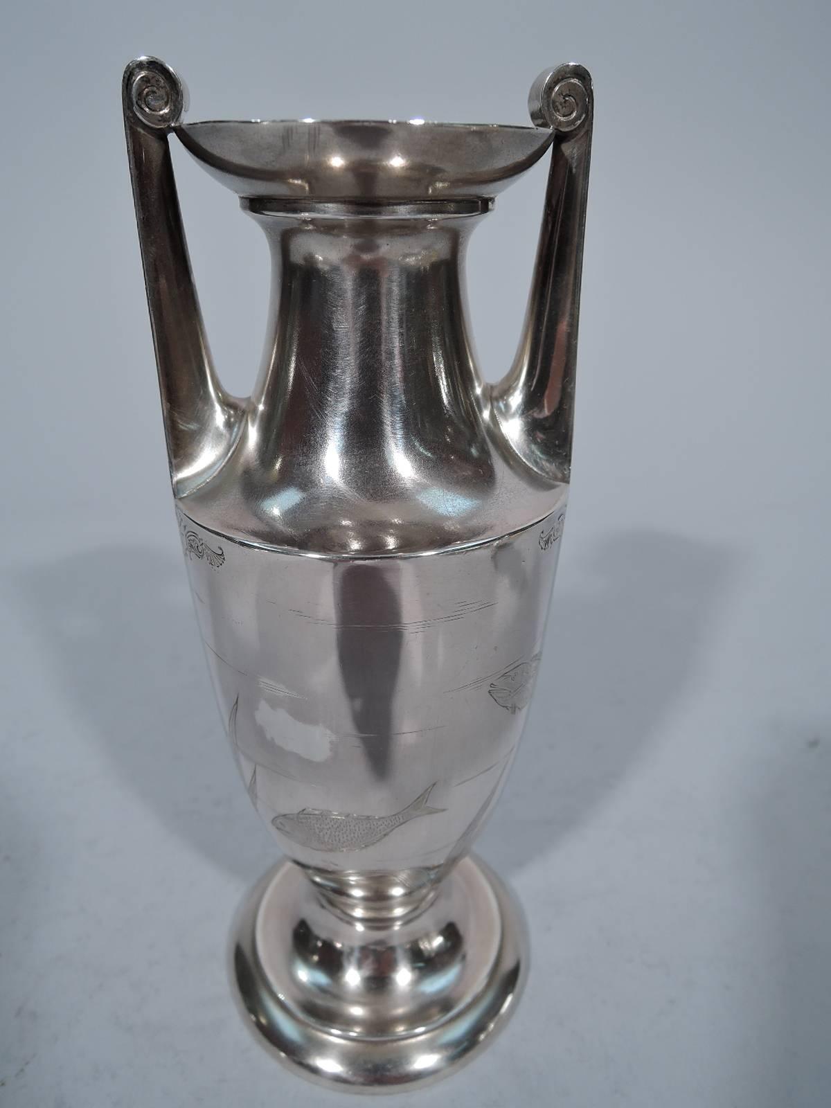 Japonesque sterling silver vase. Made by Gorham in Providence in 1876. Amphora with tapering sides, stepped foot, flared rim and vertical side handles terminating in volute scrolls. Fish and marine plants engraved on body. Arms have stylized Modern