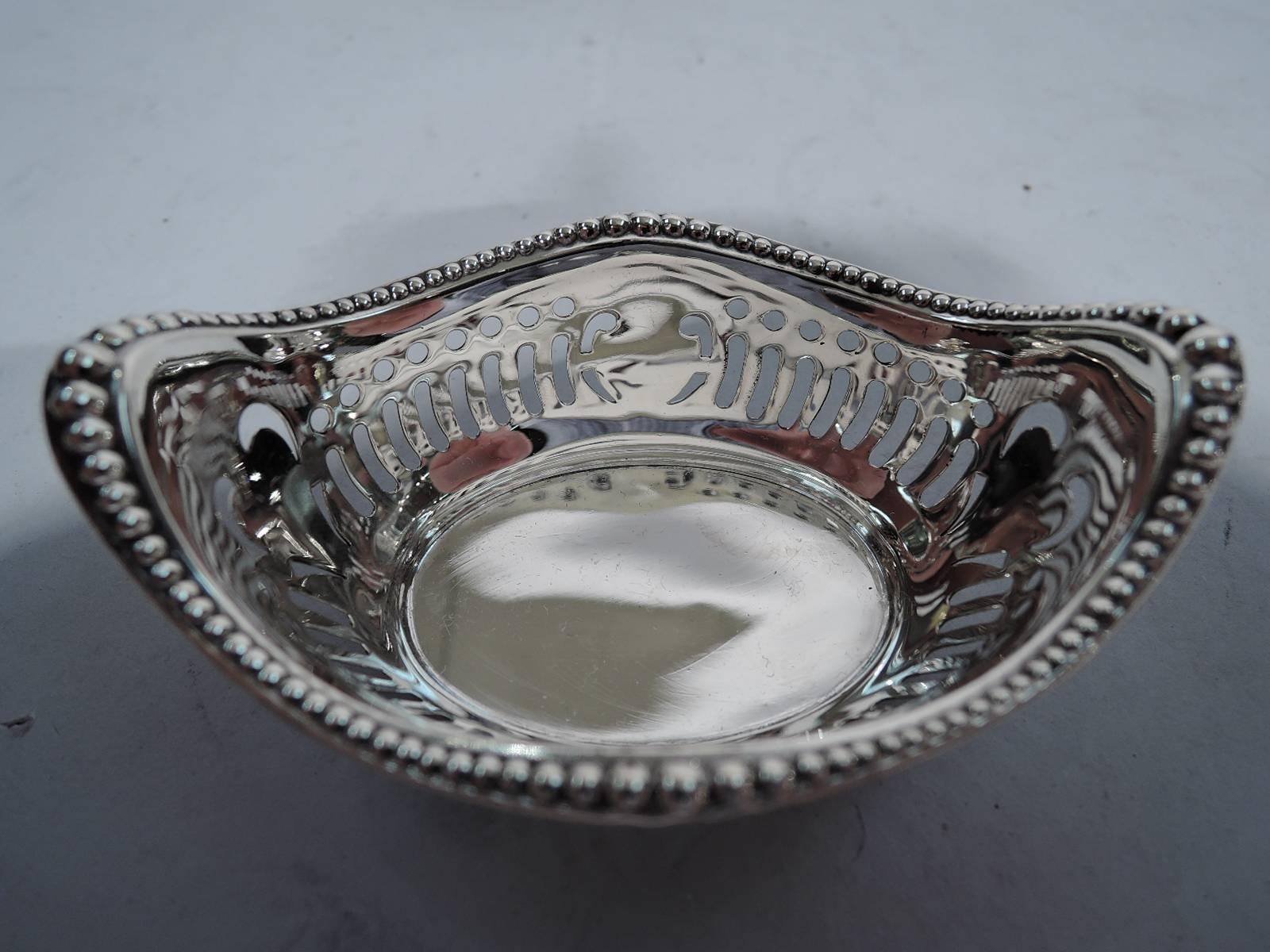Set of six sterling silver nut dishes. Made by Gorham in Providence, circa 1920. Each: boat form with pierced sides and beaded rim. Hallmark includes no. A4775. Very good condition.

Dimensions: H 1 3/8 x W 3 1/4 x D 2 1/4 in. Total weight: 4.5