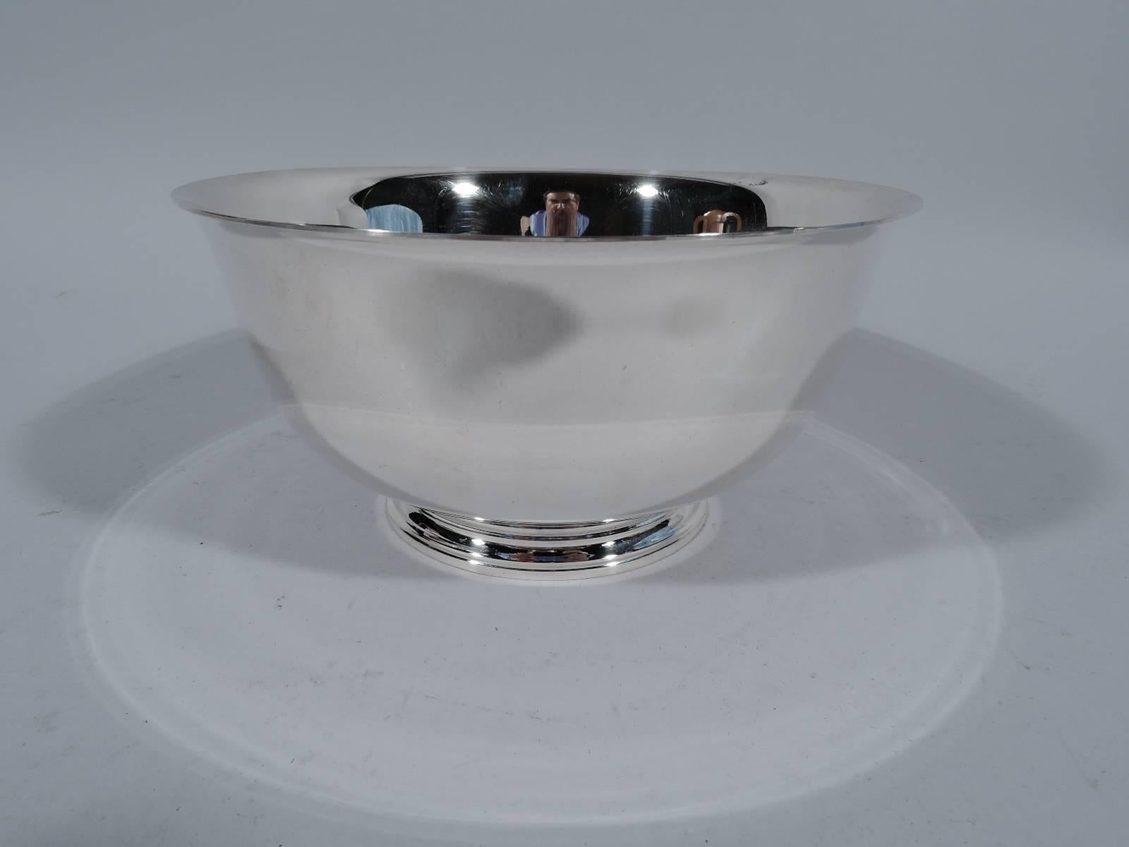 Sterling silver revere bowl. Made by Tiffany & Co. in New York. Curved sides, flared rim, and stepped foot. A nice size with plenty of room for engraving. Hallmark includes postwar pattern no. 23616. Very good condition and patina.

Dimensions: H