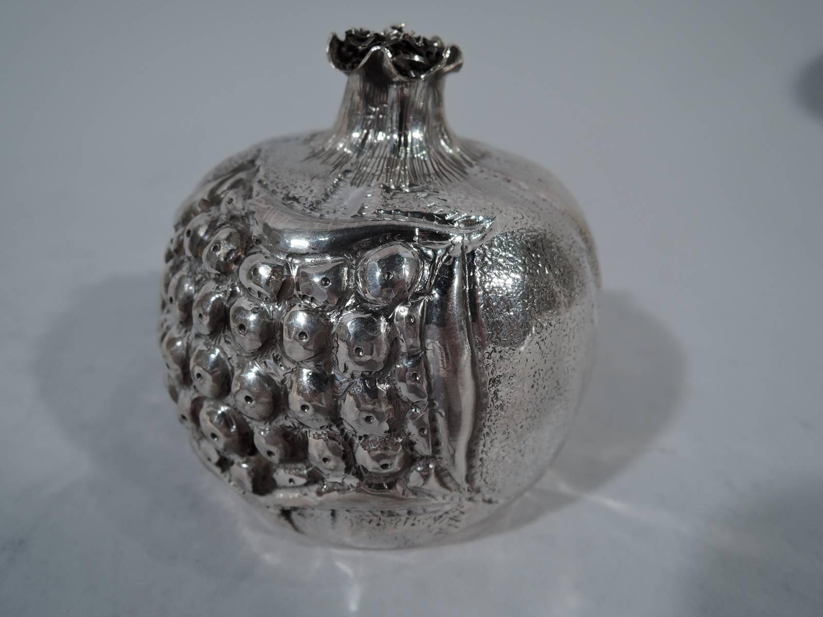 Italian 800 silver fruit-form lighter. Case in form of ripe pomegranate with broken skin exposing dense seeds. Lighter mounted to interior. Hallmark (1968 to present) with Florentine maker’s mark Brandimarte. Measure: Weight (case only) 3 troy