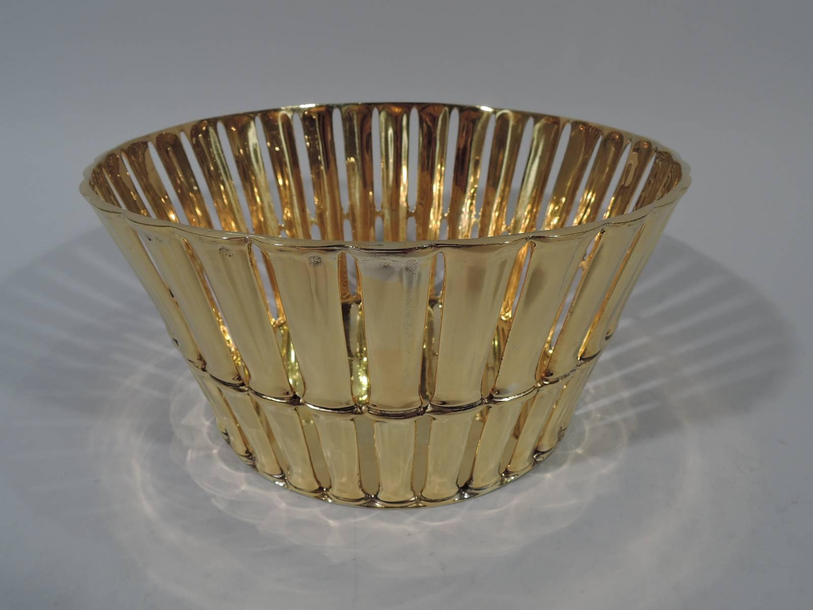 Gilt sterling silver basket in bamboo pattern. Made by Tiffany & Co. in New York. Solid well with open sides in form of bamboo stalks. A great Midcentury example of Tiffany’s ongoing interpretation of Asian motifs. With gilt metal liner. Hallmark