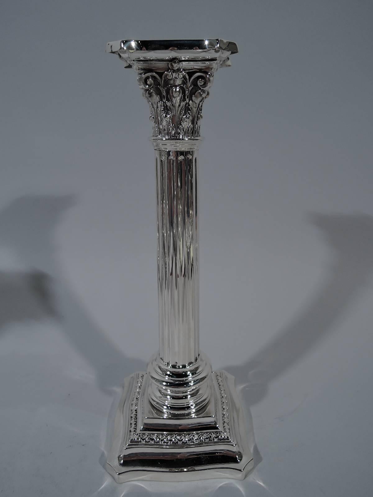 Pair of sterling silver classical candlesticks. Made by R. Wallace & Sons. Manufacture company in Wallingford, circa 1920. Each: Fluted column on stepped, shaped, and ornamented square base. Composite capital with chamfered and concave top.