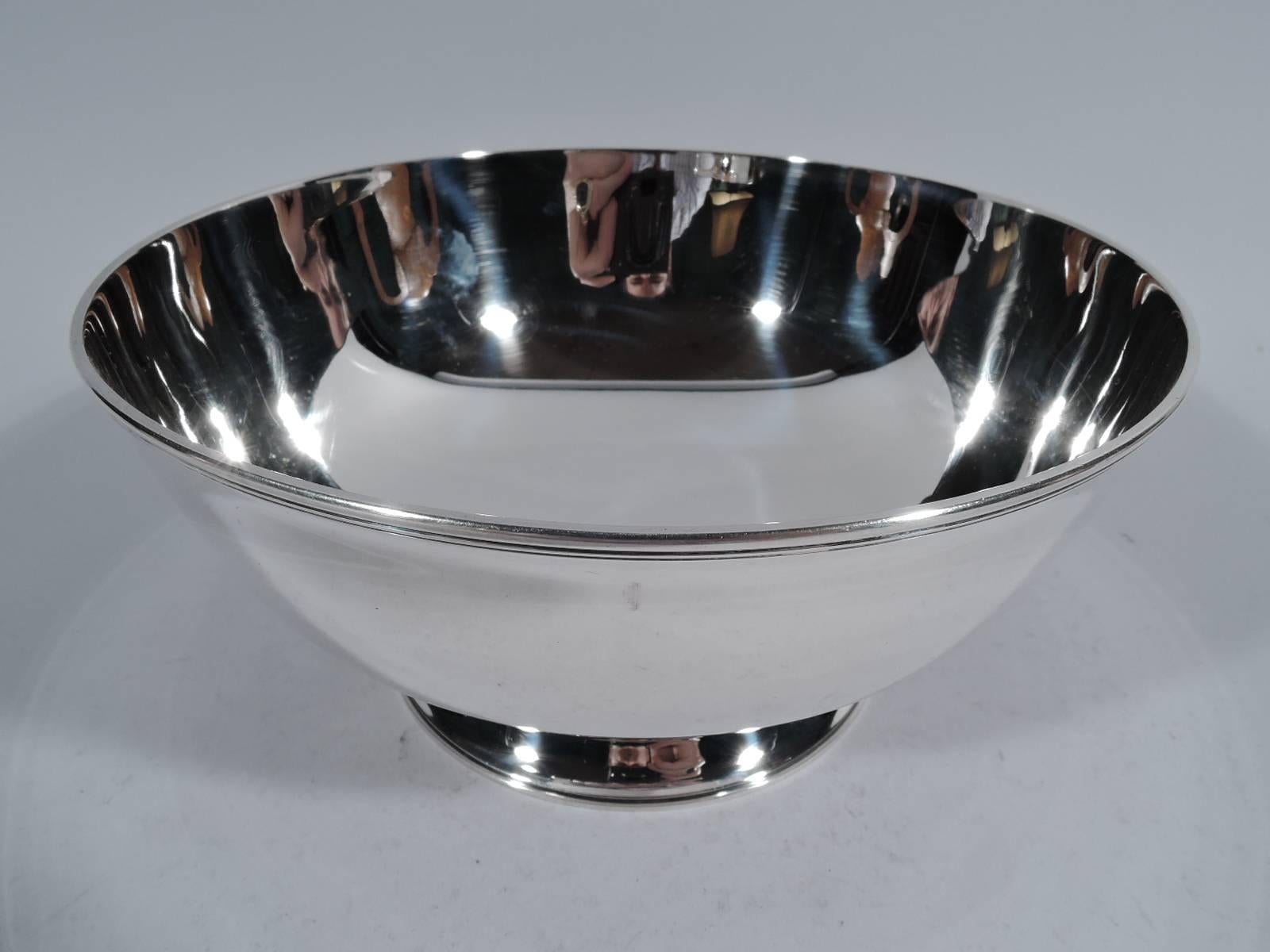 Federal style sterling silver bowl. Made by Tiffany & Co. in New York. Bowl has curved sides, reeded rim, and stepped foot. Spare classicism after a historic prototype. Hallmark includes pattern no. 19168L, director's letter L (1956-ca 1965), and