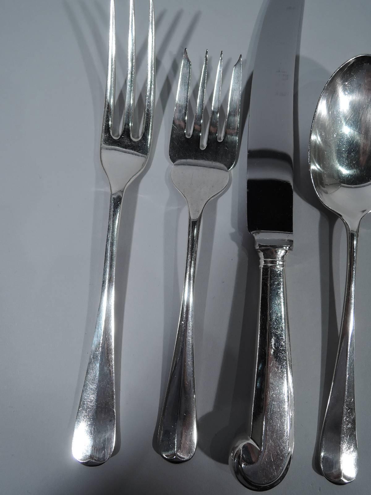 English sterling silver dinner service in Rat Tail pattern. This service comprises 83 pieces (all dimensions in inches): Knives: 12 dinner knives (8 3/8) and 12 butter spreaders (6 1/8); Forks: 12 dinner forks (7 3/8) and 11 salad forks (6 5/8); 12