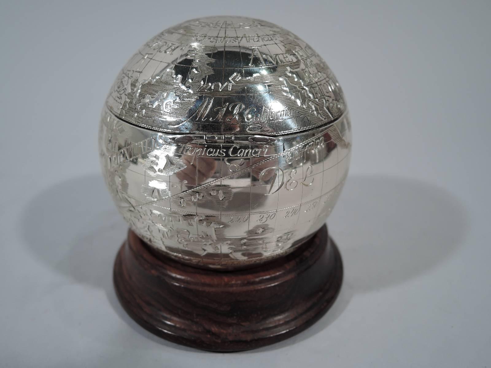 Sterling silver globe box. Retailed by Tiffany & Co. in New York. Never lose your cuff links again all while holding the world in the palm of your hand. Continents, oceans, and countries labeled in a variety of scripts and languages. Cover hinged