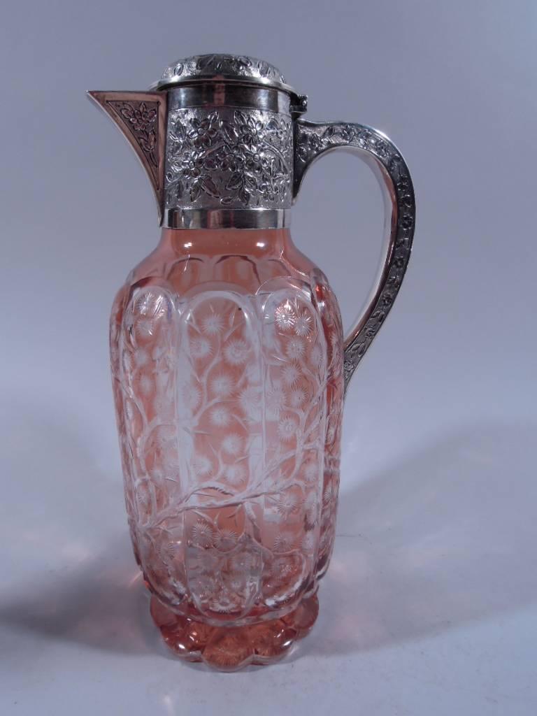 Victorian sterling silver and salmon crystal decanter. Made by John Thomas Heath & John Hartshorne Middleton in London in 1891. Curved sides and flat scalloped foot. Ten vertical lobes with entwined cut-to-clear blossoming branches. Flower heads