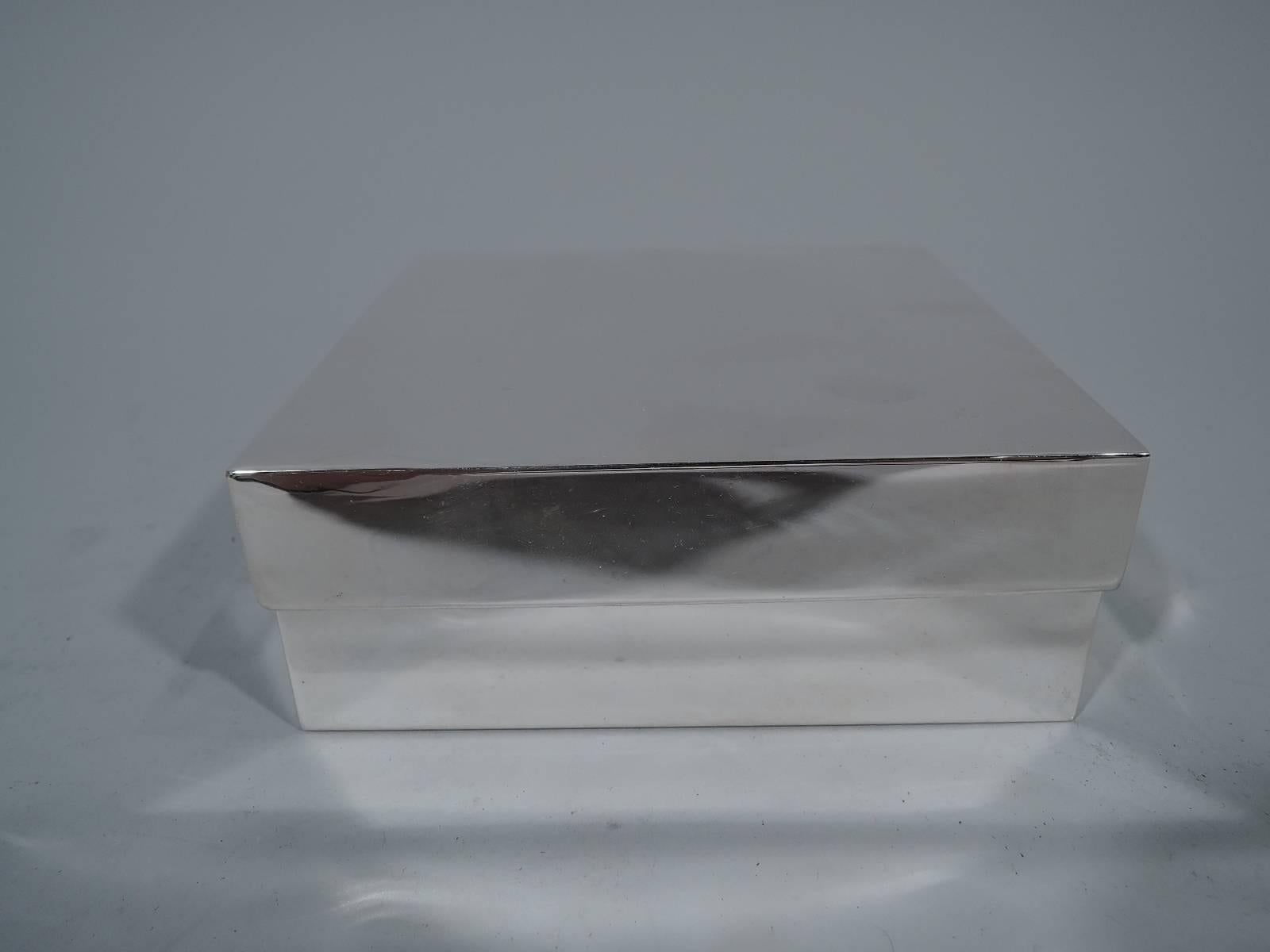 Covered sterling silver box. Retailed by Tiffany & Co. in New York. Square with straight sides. Cover flat with overlapping straight sides. The perfect gift box – just add ribbon. Italian hallmark (1968 to present) with Florentine maker’s mark and