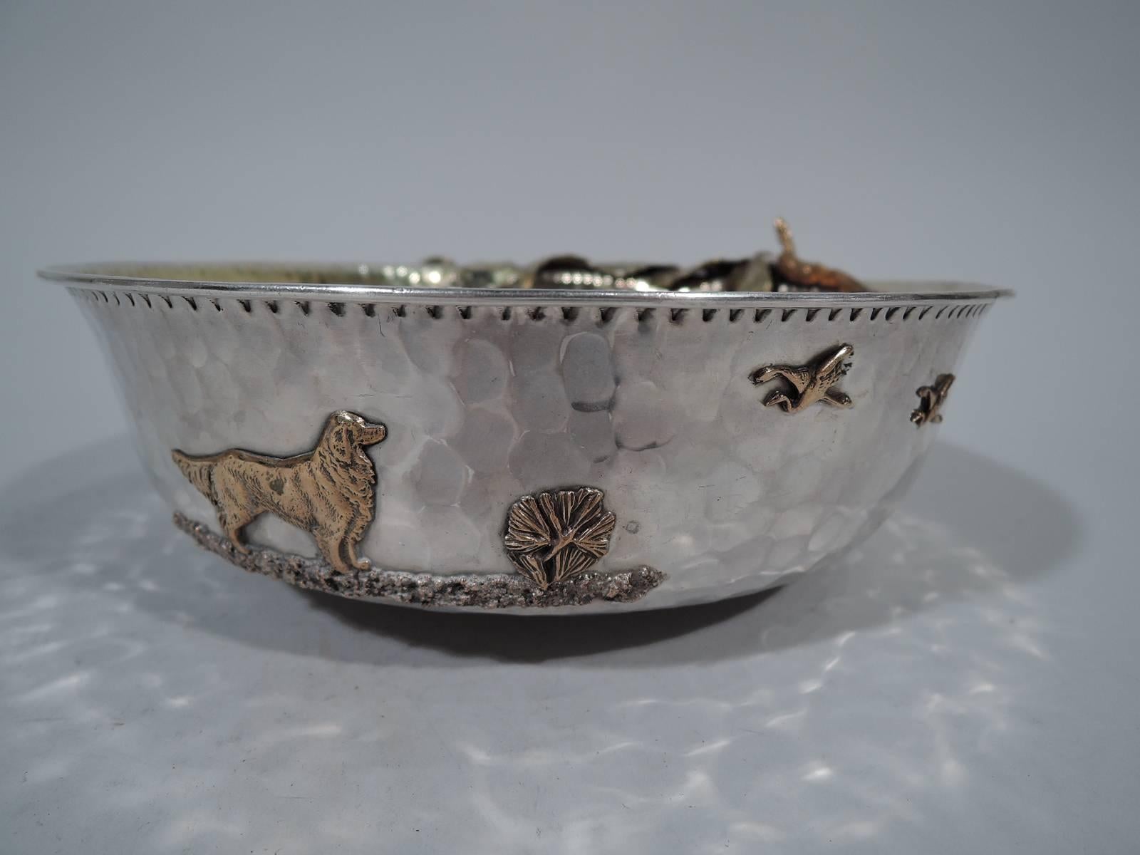 Wonderful sterling silver and mixed metal bowl. Made by Gorham in Providence in 1882. Round with tapering sides and all-over hand hammering visible on interior and exterior. Fruiting branch with overhanging cherries applied to one side. On other a