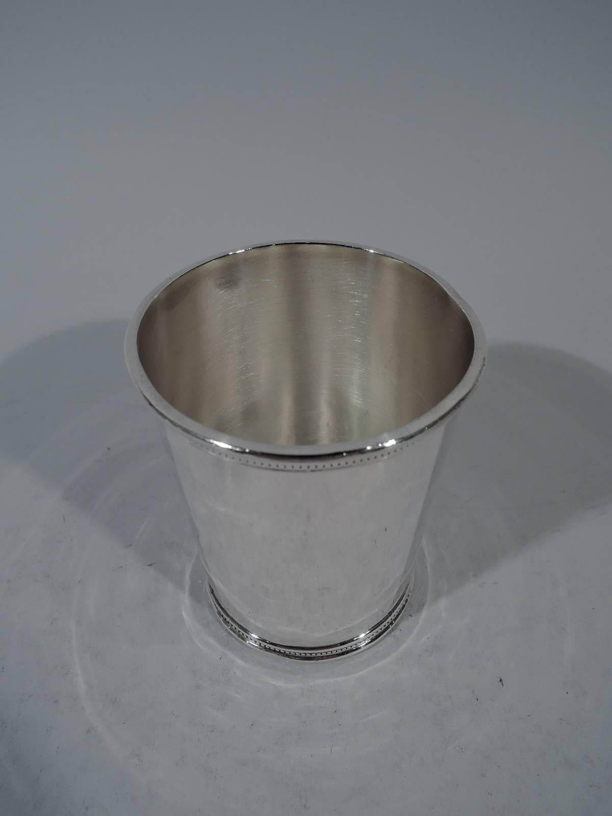 Kennedy-era sterling silver mint julep. Retailed by Scearce in Kentucy, 1961-1963. Traditional form with tapering sides and beading at rim and foot. Not many of these were made during the 35th president’s incomplete single term. Hallmark includes