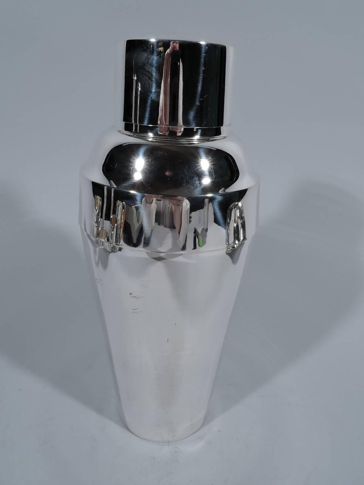 Modern sterling silver cocktail shaker. Made by Georg Jensen Inc. USA, circa 1960. Straight and tapering sides. Cover has curved shoulders and straight neck with built-in strainer and snug-fitting cover. Terrific Midcentury barware. Hallmark