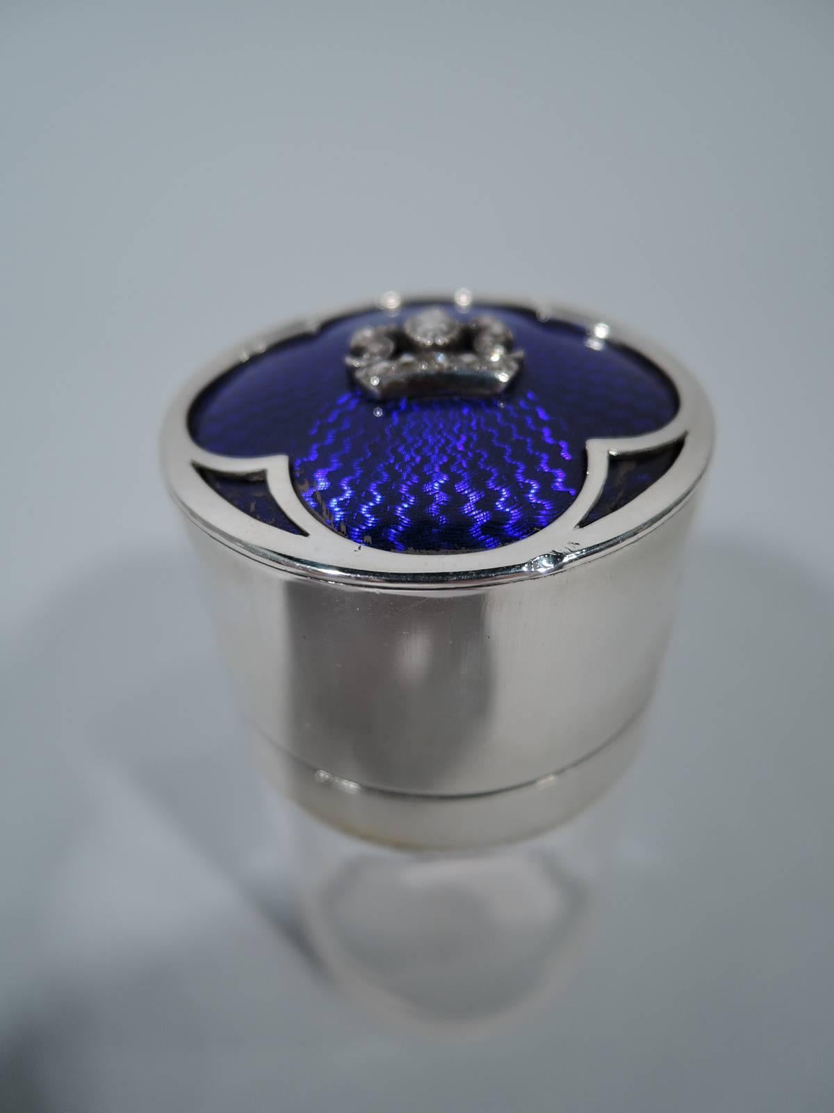 Edwardian clear glass vanity jar and sterling silver and enamel jar decorated with diamonds. Made in London in 1902. Cylindrical with silver collar and hinged cover. Cover top has radiating cobalt guilloche enamel overlaid with silver quatrefoil and
