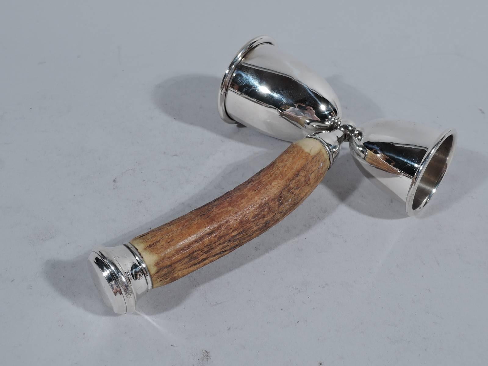 Sterling silver double jigger, circa 1910. Made by John Hasselbring in Brooklyn. Single and double-shot measuring cups mounted dos-a-dos to stag’s horn. End mount vacant. A great piece by a New York maker, who was active in the first half of the
