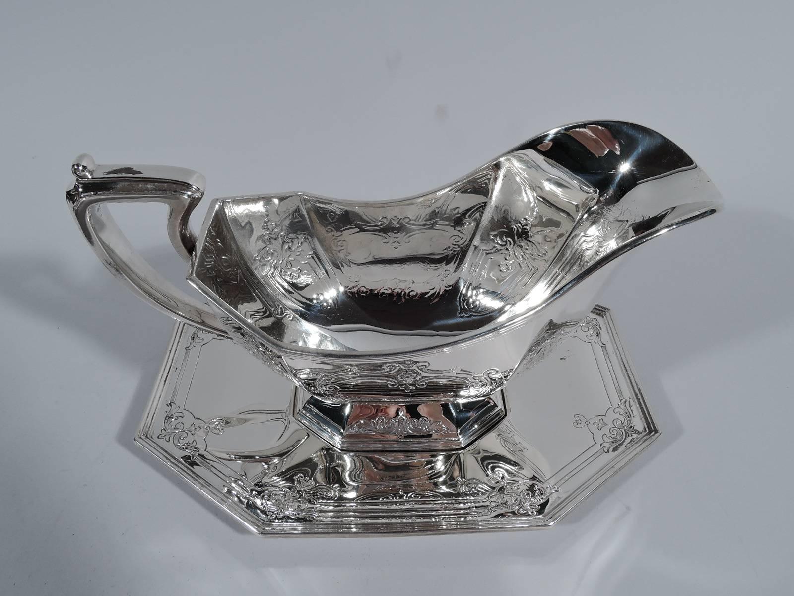 antique silver gravy boat with stand