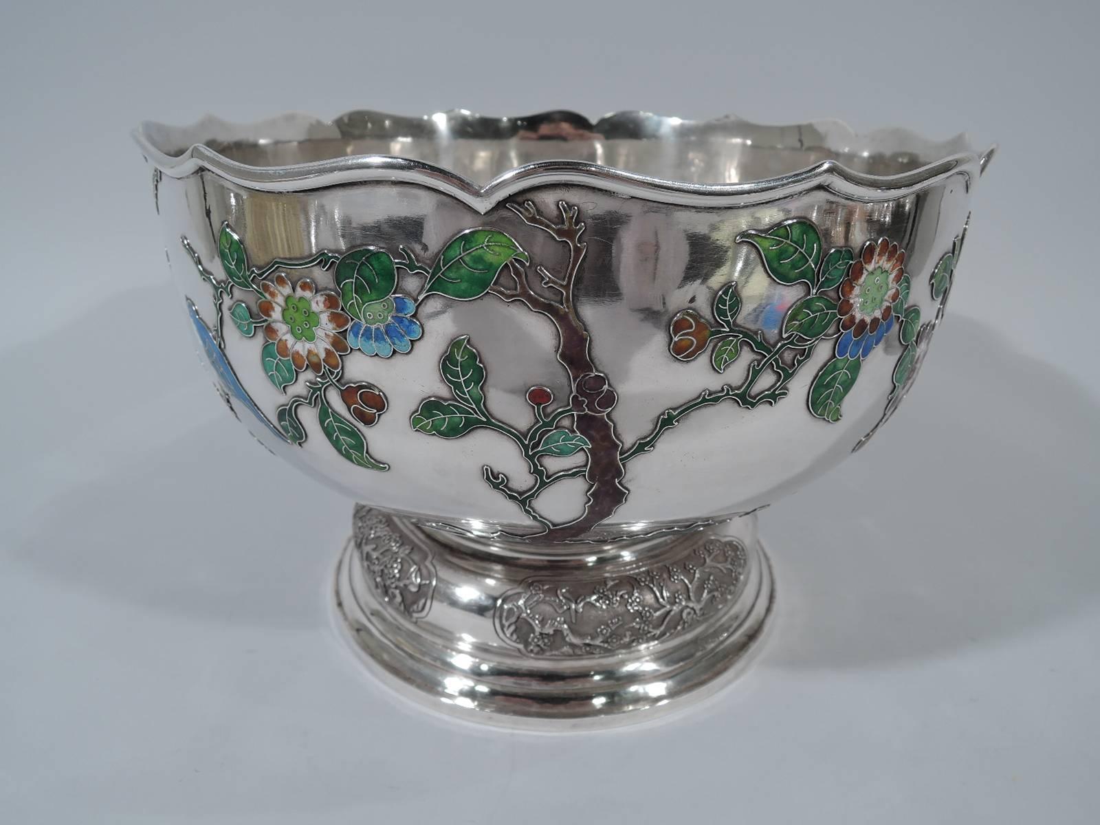 Very fine Chinese silver bowl with enamel ornament. Curved sides with molded and scrolled rim, and stepped and domed foot. Applied enamel flora and fauna, including red, purple, and blue flowers with veined green leaves and blue and white birds.