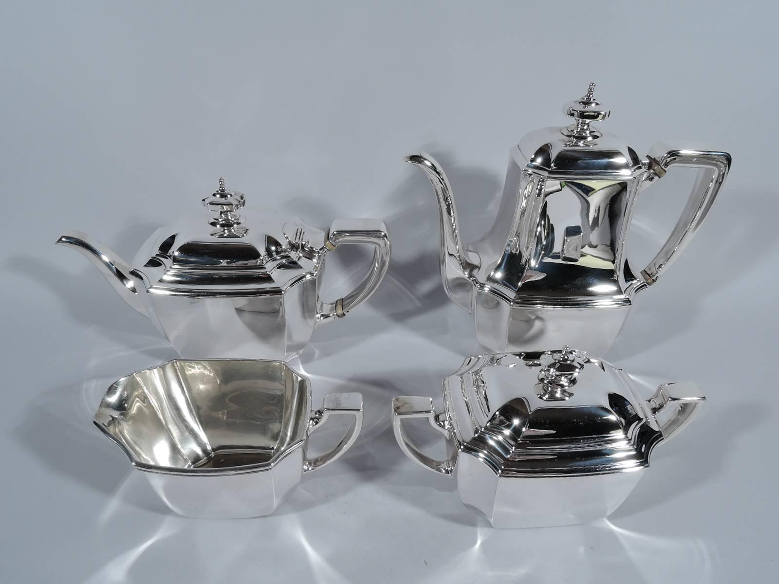 Sterling silver four-piece coffee and tea set in Hampton pattern. Made by Tiffany & Co. in New York, circa 1912. This set comprises coffeepot, teapot, creamer, and sugar.

Rectilinear with curved sides, concave corners, and stepped rim. Covers
