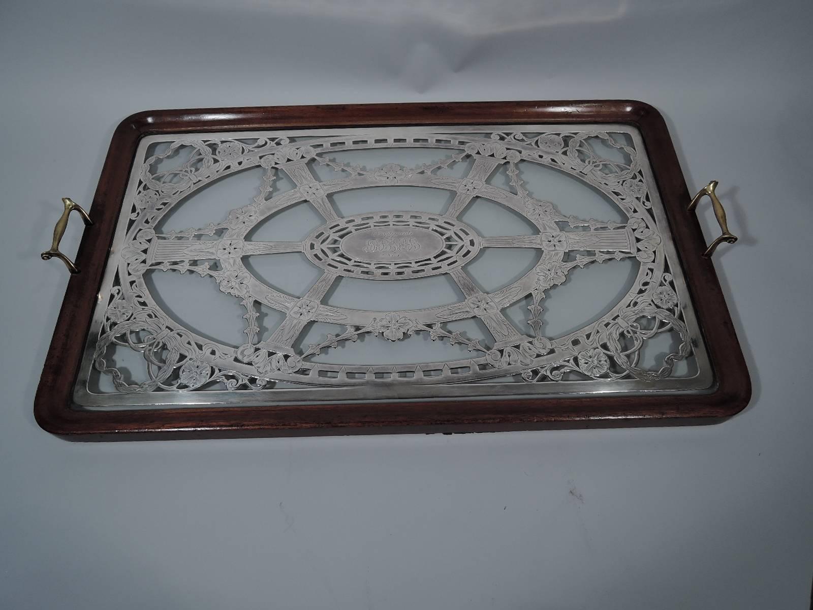 Rare antique American glass serving tray with silver overlay. Rectangular clear glass overlaid with neoclassical ornament. Central patera surrounded by fluted pilasters and garland. Corner wreaths. Engraved presentation. Glass set in stained-wood