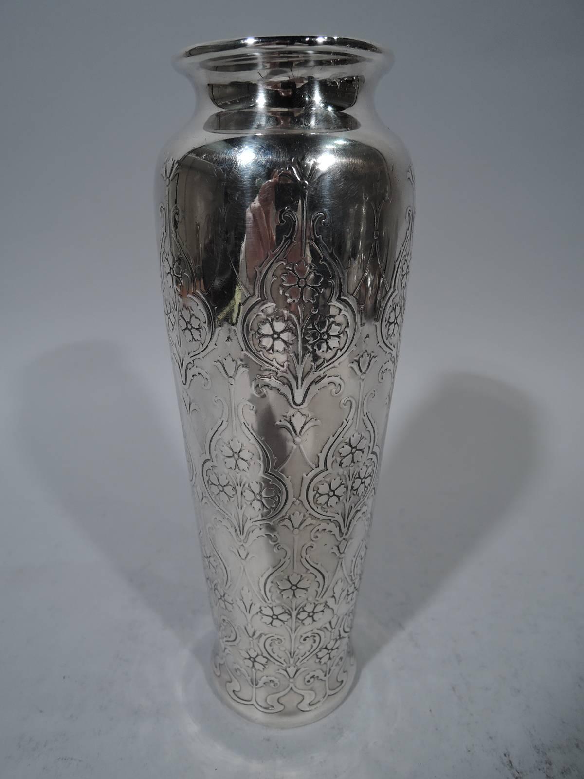 Art Nouveau sterling silver vase. Made by Tiffany & Co. in New York, circa 1911. Tapering sides with inset neck. Acid-etched repeating pattern with trefoils inset with flowers. Hallmark includes pattern no. 18097B (first produced in 1911) and