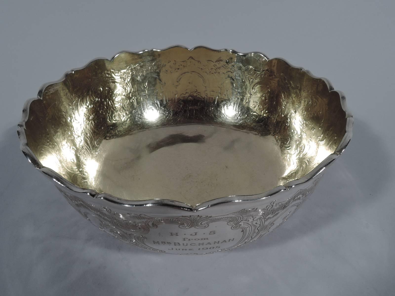 Chinese export silver bowl. Curved sides, short foot, and scrolled rim. Finely engraved arcade with flowers and scrolls as well as presentation dated 1905. Interior gilt. Hallmarked Linchong (or Lynchong), a Cantonese maker active in the early 19th