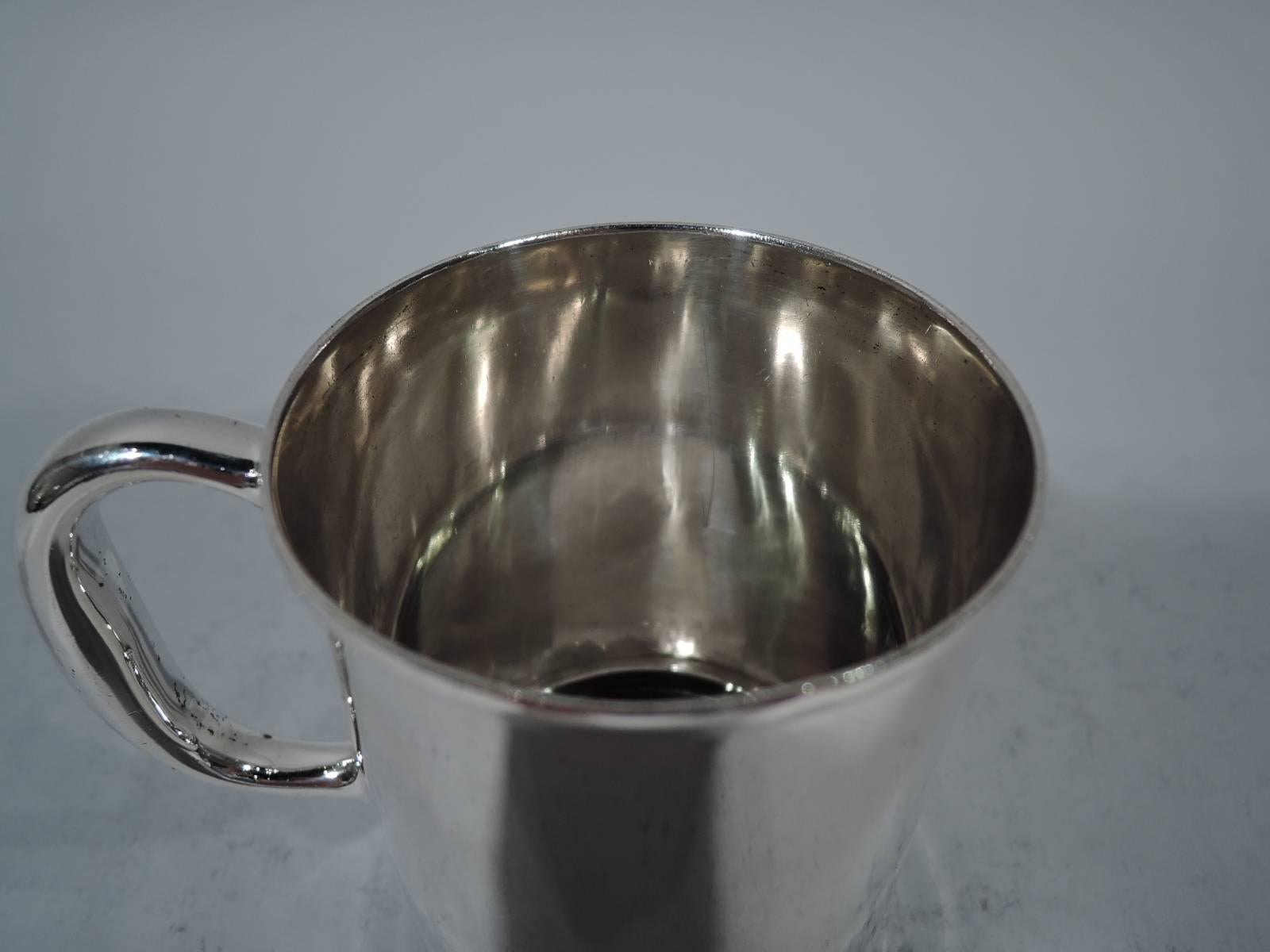 Edwardian sterling silver baby cup. Made by Tiffany & Co. in New York, circa 1909. Straight sides, raised and inset foot, and C-scroll handle. Lots and lots of room for engraving. Hallmark includes pattern no. 17285 (first produced in 1909) and