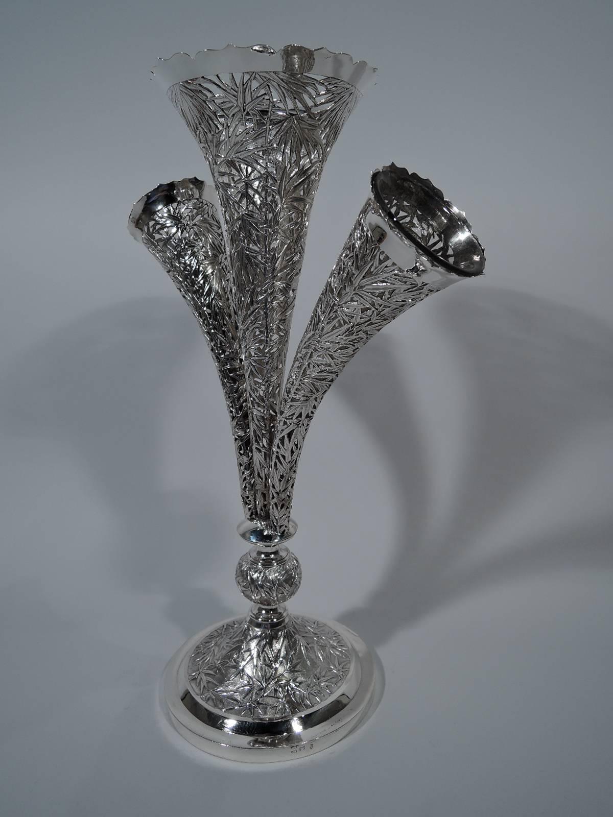 Rare and exciting Chinese export silver epergne, circa 1900. Three conical vases mounted to knop on raised foot. Raised bamboo motif on stippled ground. Vases pierced with clear glass liners. A standout centerpiece by Wang Hing, who was active in