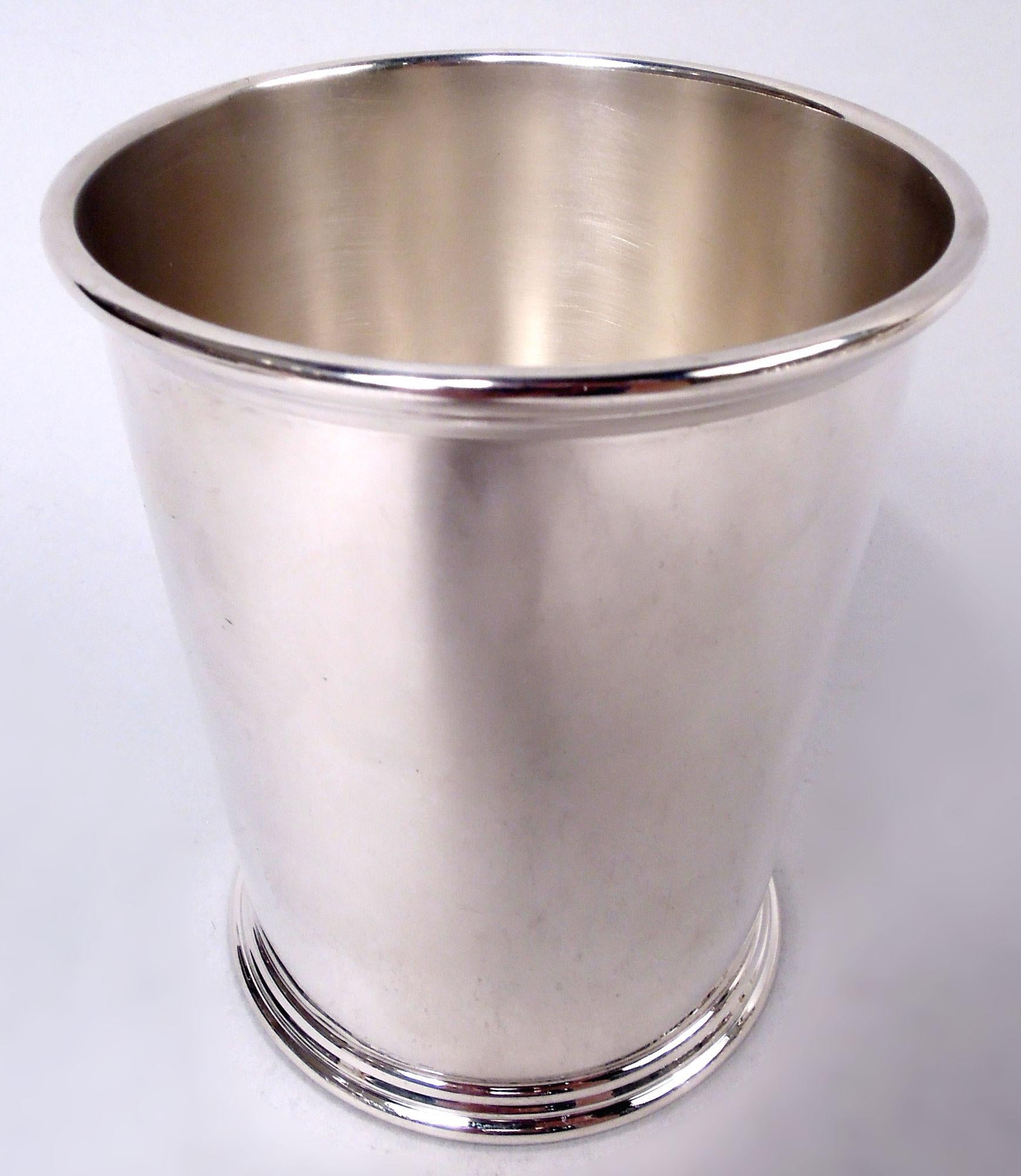Set of 8 sterling silver mint julep cups. Made by S. Kirk & Son in Baltimore. Each: Straight and tapering sides with molded rim and skirted foot. Fully marked including maker’s stamp (1932-61) and no. 277. Total weight: 31.5 troy ounces. 