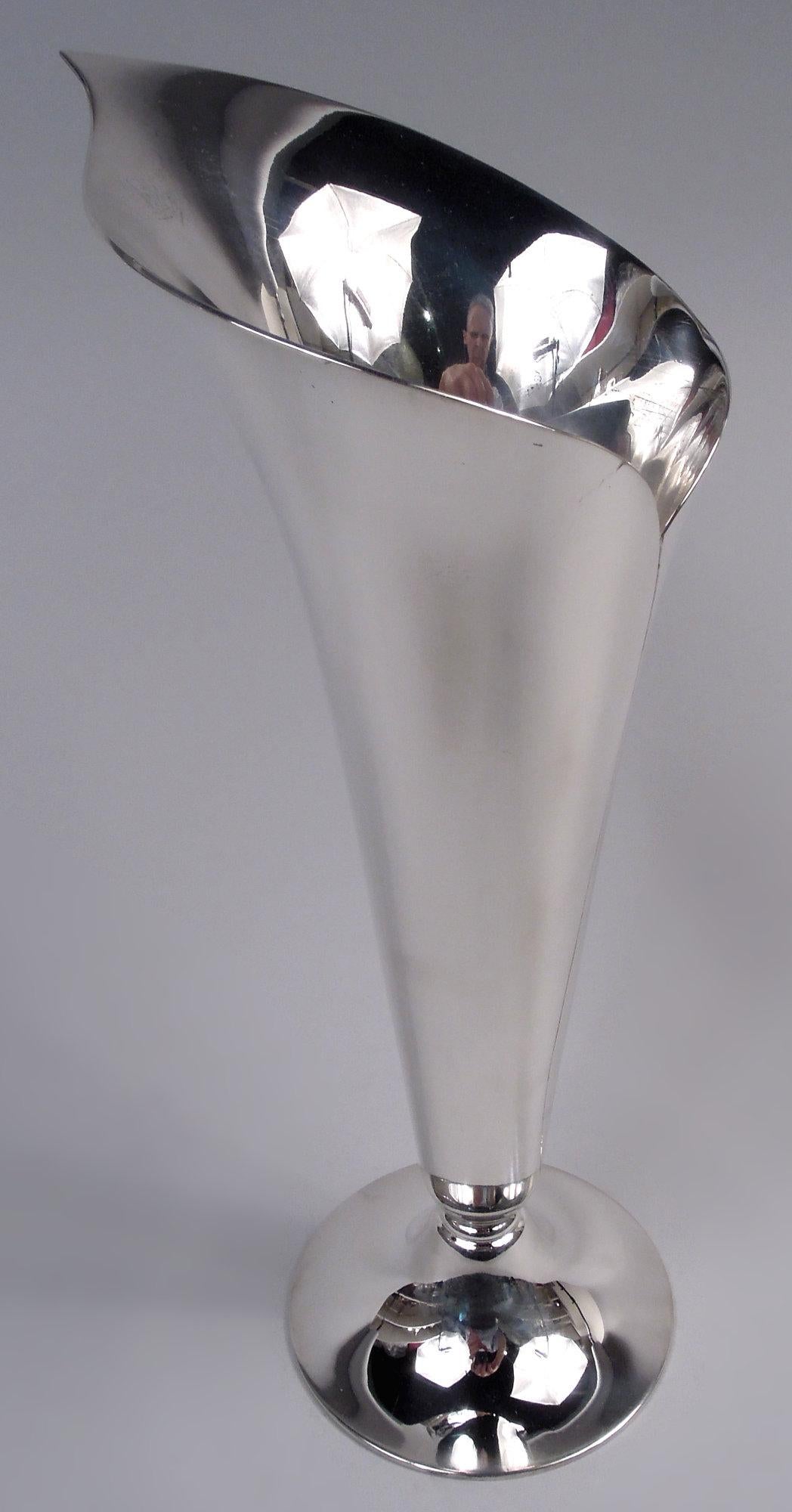 Classic Midcentury Modern sterling silver vase. Made by Tiffany & Co. in New York. Conical. In form of abstract calla lily with asymmetrical mouth and irregular seam. Raised round foot. Fully marked including maker’s stamp, postwar pattern no.