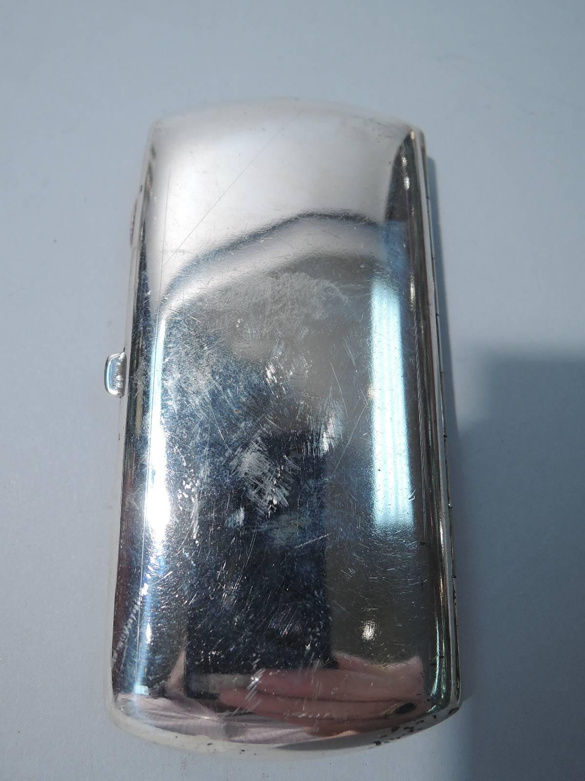 Antique Austrian 900 silver and enamel cigarette case. Narrow and rectangular with curved ends. On cover is seated kitty with straight forelegs, straight-on gaze and erect pointy ears. An austere feline softened by shaded striped fur and white paws.