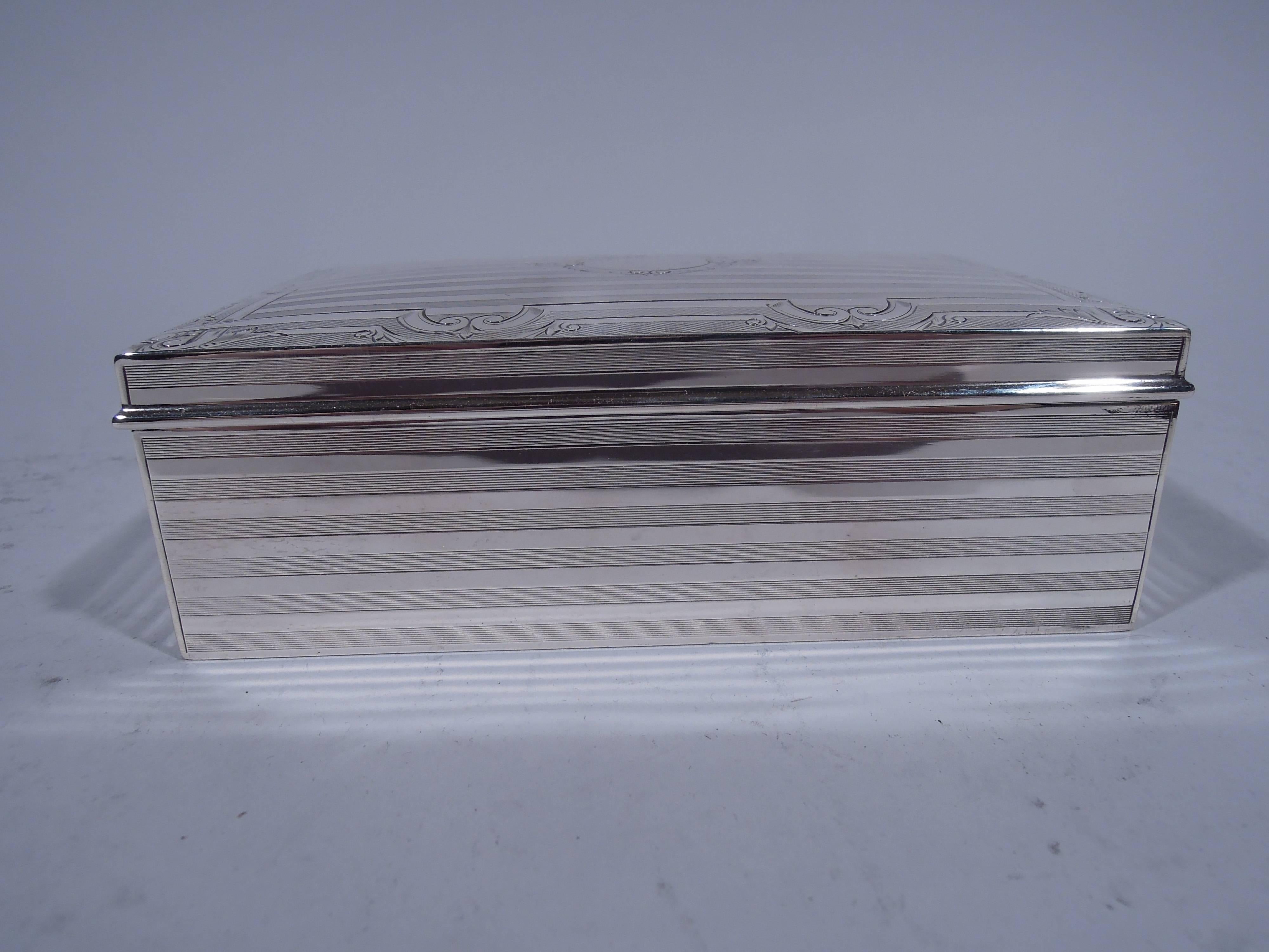 Edwardian sterling silver box. Made by John Chatellier in Newark, circa 1915. Rectangular with wraparound stripes: Reeded alternating with plain. Cover curved and hinged with molded rim. Same ornament with strapwork border on engine-turned ground