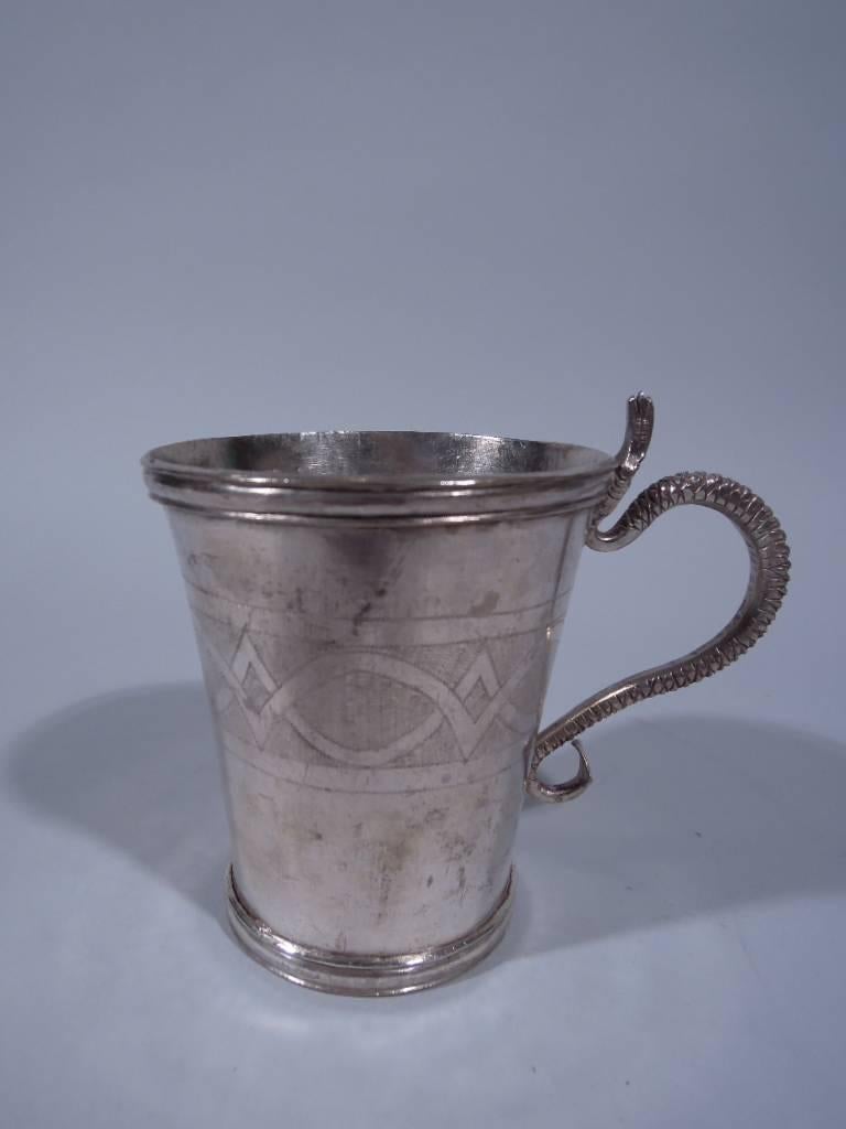 Nice old South American silver mug. Handmade. Applied scroll handle in form of scaly snake. Ornamental band engraved on cup. Uncleaned to protect the patina.

Dimensions: H 4 3/8 x W 5 1/4 x D 3 1/2 in. Weight: 7 troy ounces. BM406.