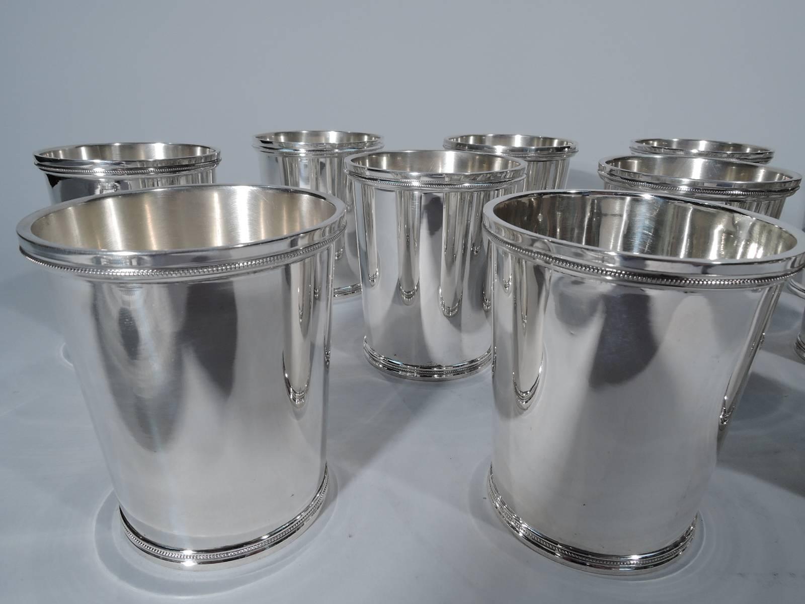 Set of 12 sterling silver mint julep cups. Straight and tapering sides. Molded rims with dentil. A great hard-to-find large set. Hallmarked Chicago Silver Co. (ca 1925-50) with no. 340. Very good condition.

Dimensions: H 3 3/4 x D 3 1/8 in. Total