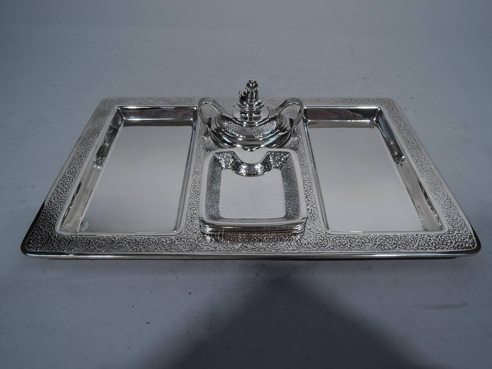 Sterling silver smoking set. Made by Tiffany & Co. in New York, circa 1916. This set comprises one tray, six ashtrays and one cigar lighter.

Tray has four plain wells: Two rectangles for cigars, one square for matches and one circle for cigar