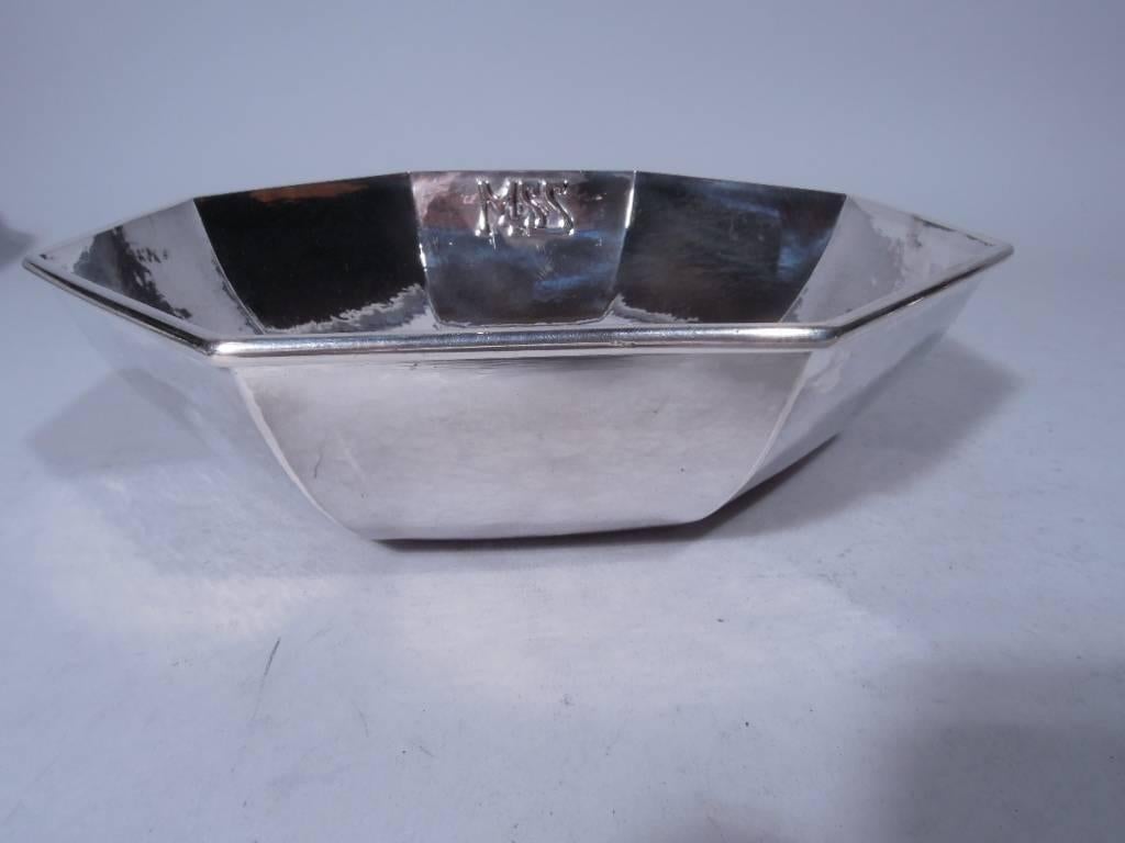 Art Deco sterling silver bowl. Made by Kalo in Chicago, 1914-1918. Octagonal with curved and tapering sides. Study with visible hand hammering. Interlaced monogram applied to interior. A striking foray into the geometric style by this Classic