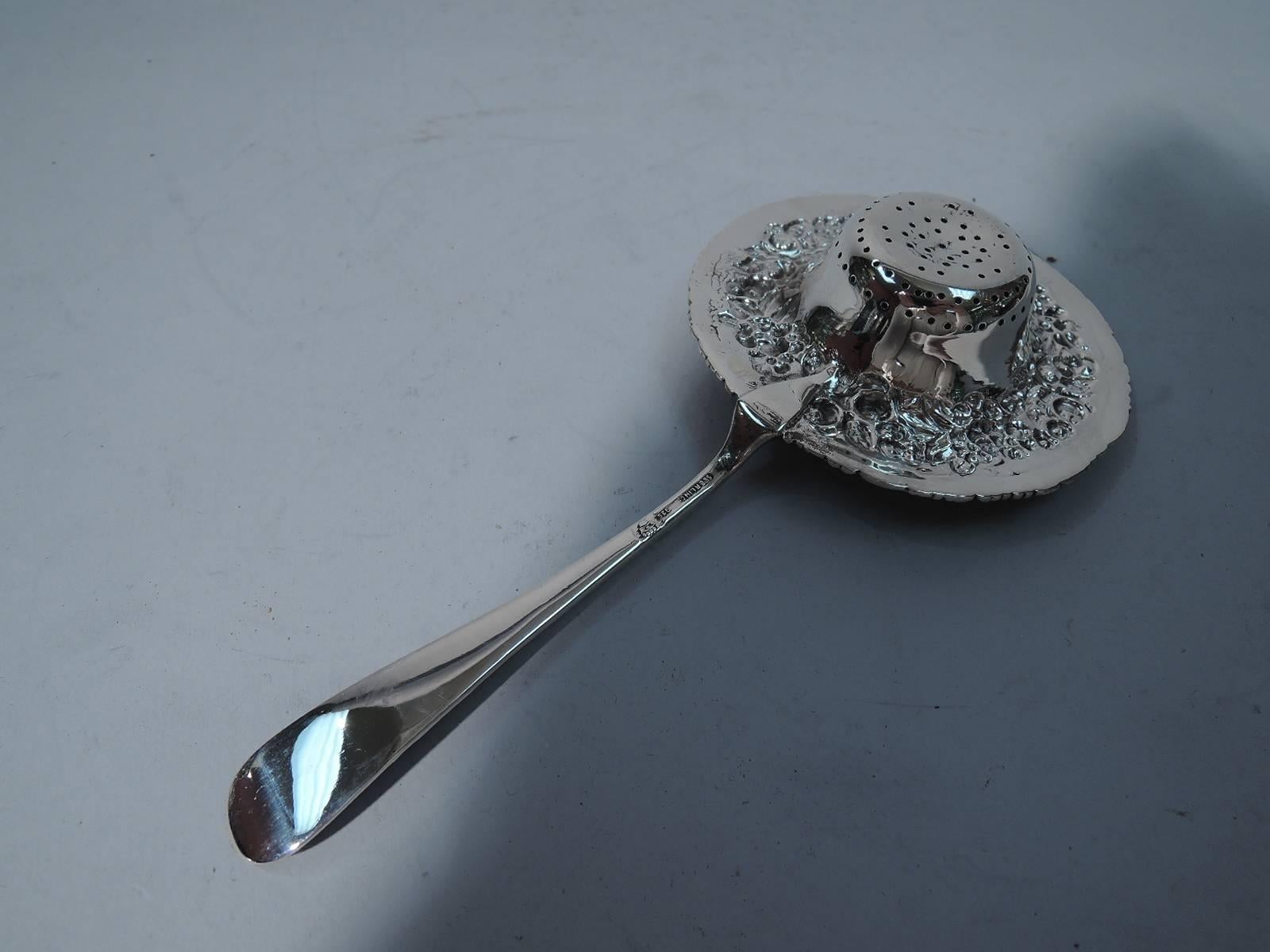 Great quality sterling silver tea strainer. All-over floral repousse and gilt and pierced bowl. Hallmarked “sterling-925” and crown for the Baltimore Sterling Silver Co., which was later the Stieff Co. Excellent condition and nice