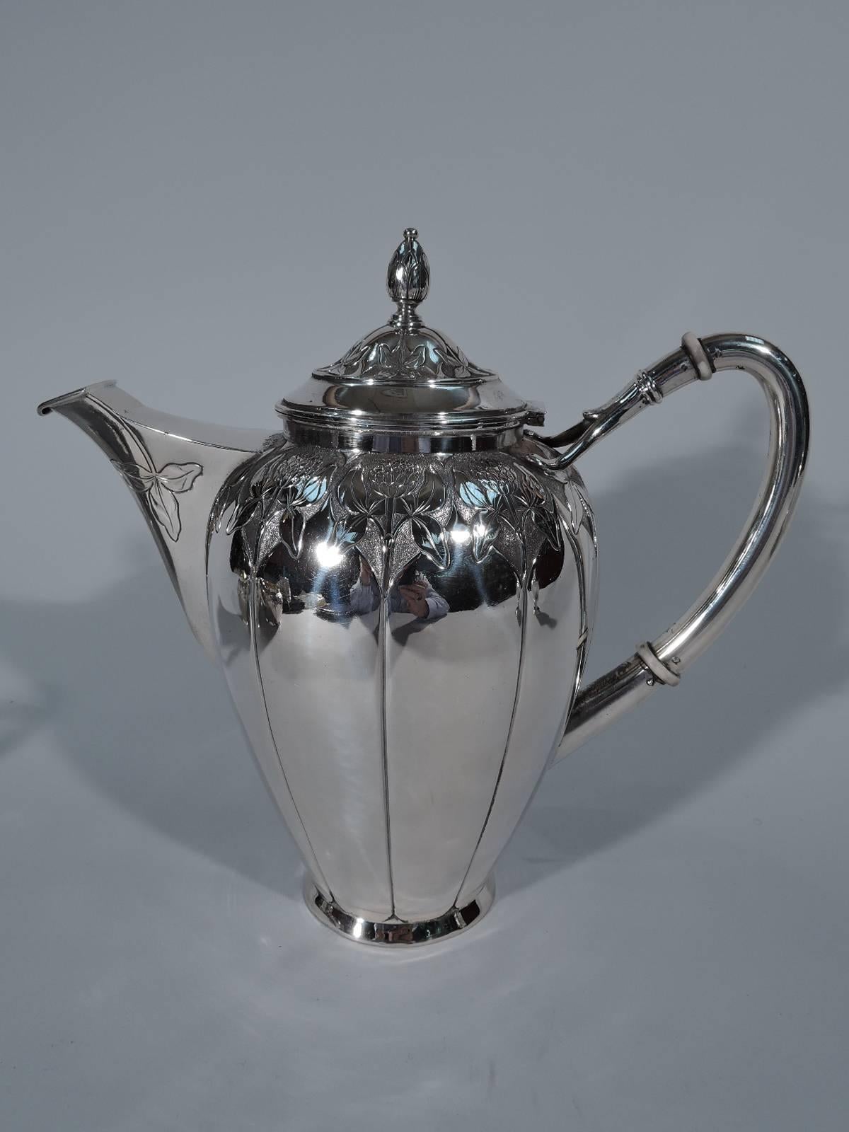 Wonderful three-piece silver coffee service. Made in Denmark in 1905. This service comprises coffeepot, creamer and sugar. 

Each: curved and tapering body, short collar and high scroll handle with split mount. Coffeepot has mounted v-spout and