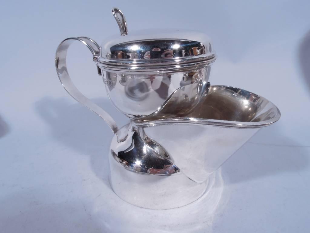 Edwardian sterling silver shaving mug. Made in Birmingham in 1904. Double bowl with wide u-form spout, s-scroll handle, and hinged cover with thumb rest. A great gift for enlivening a man’s daily toilette. Hallmark includes Birmingham retailer’s