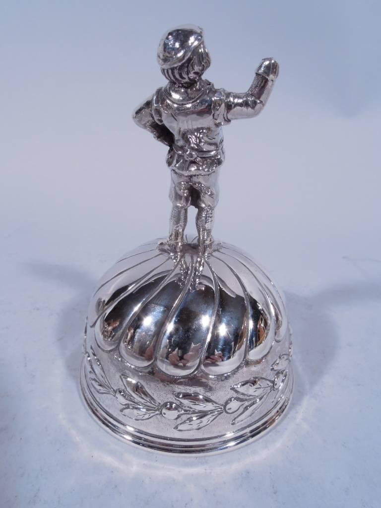 German sterling silver bell. Imported to Chester by GB in 1907. Hemispheric bowl with lobing and leaf band. Figural finial in person of working man in culottes and apron with hand on hip. Maker’s and importer’s marks. Nice patina and melodious