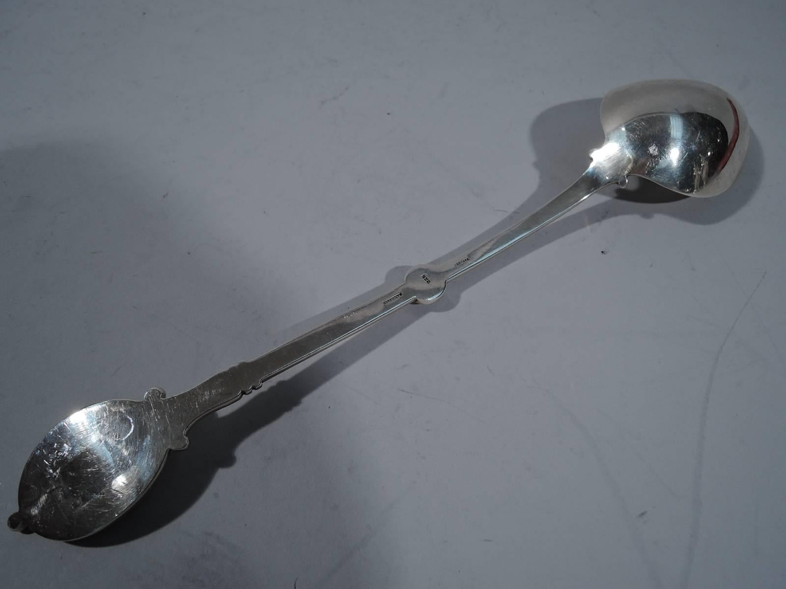 Sterling silver stuffing spoon in medallion pattern. Made by Bailey & Co. (predecessor to Bailey, Banks & Biddle) in Philadelphia, circa 1870. Curved handle terminating in oval medallion applied with Centurion’s head on engraved linear ground. A
